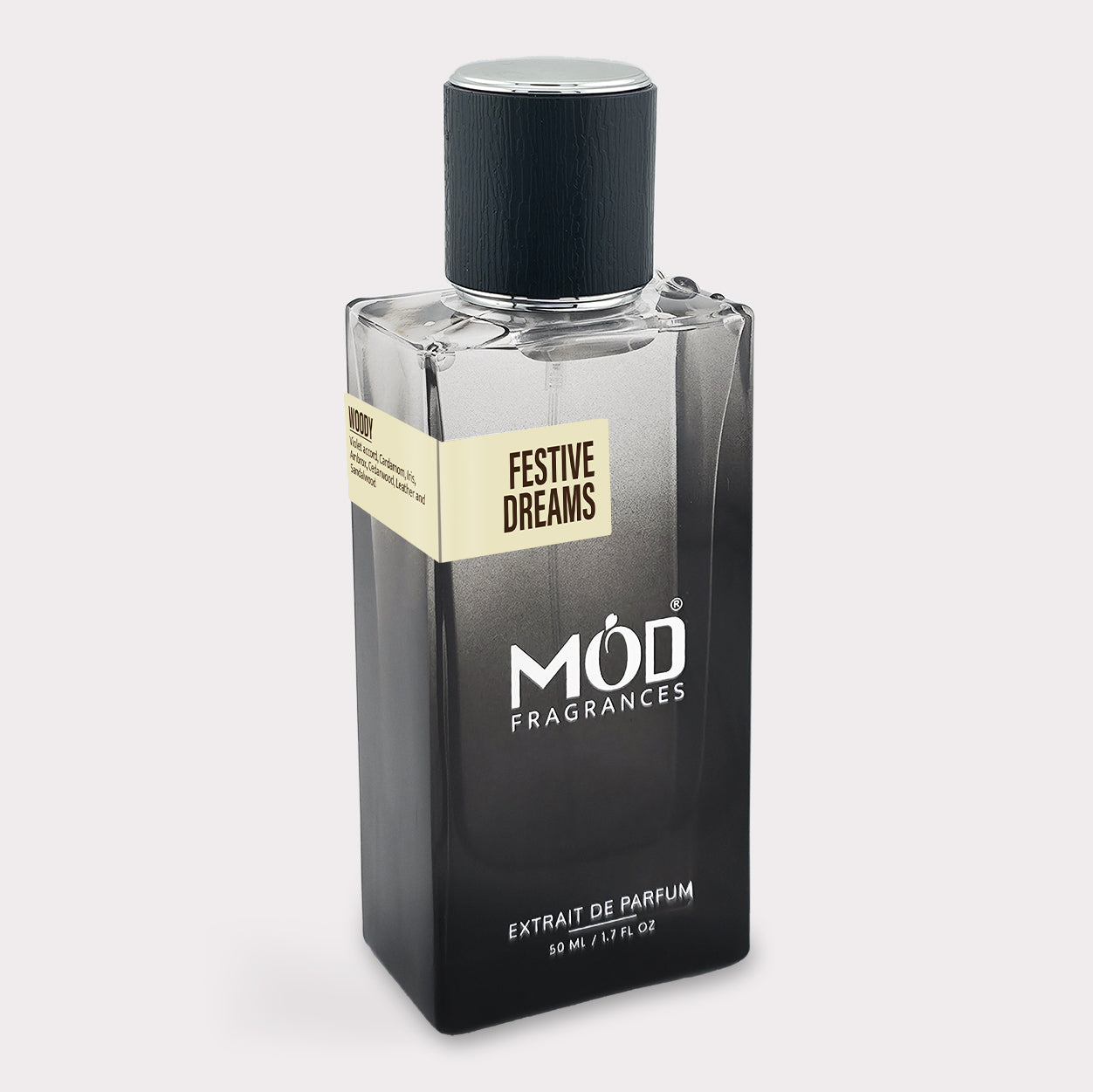 Perfume bottle labeled 'Festive Dreams' by Möd Fragrances on a light gray background