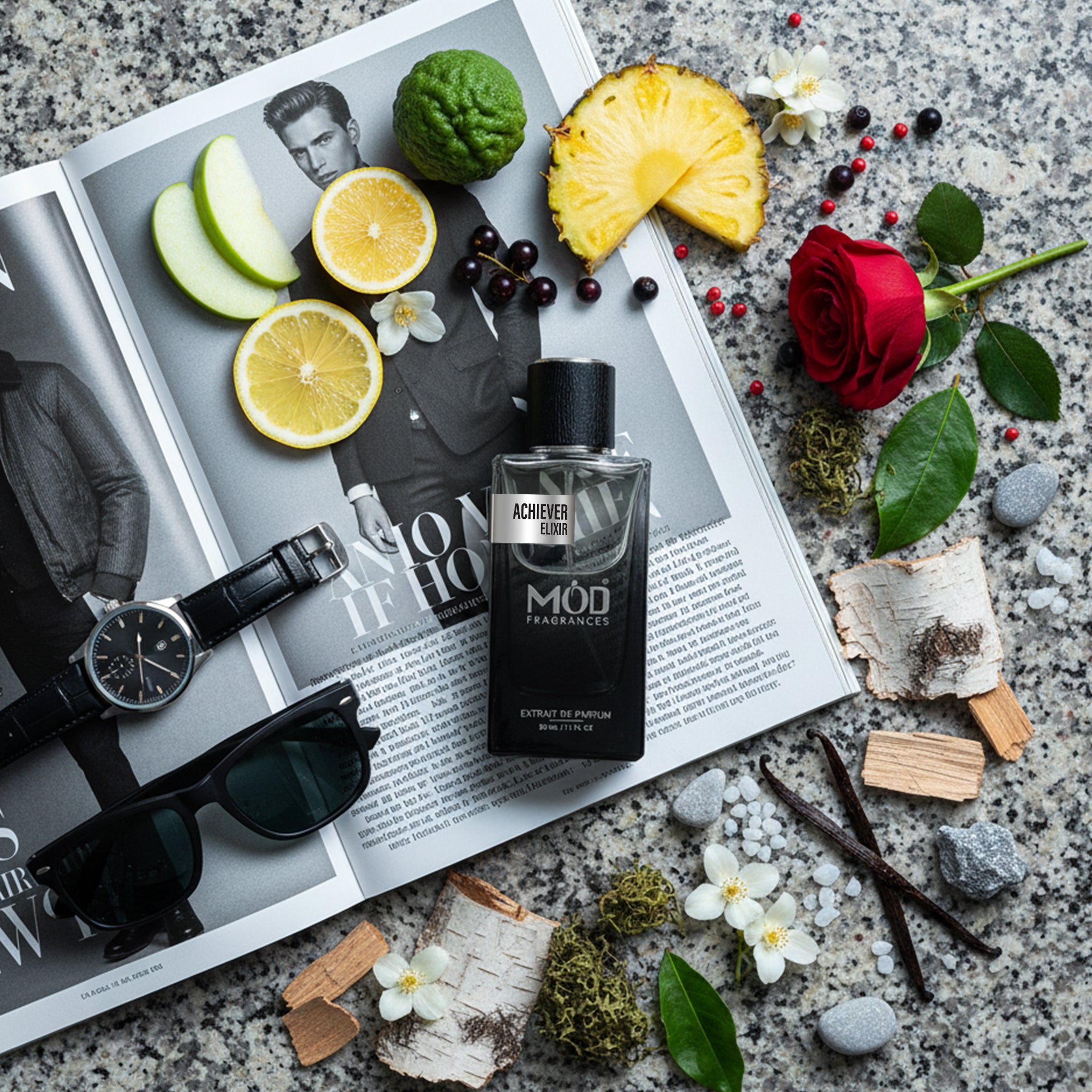 MOD Fragrances bottle on a magazine with fruits, flowers, and accessories on a textured surface