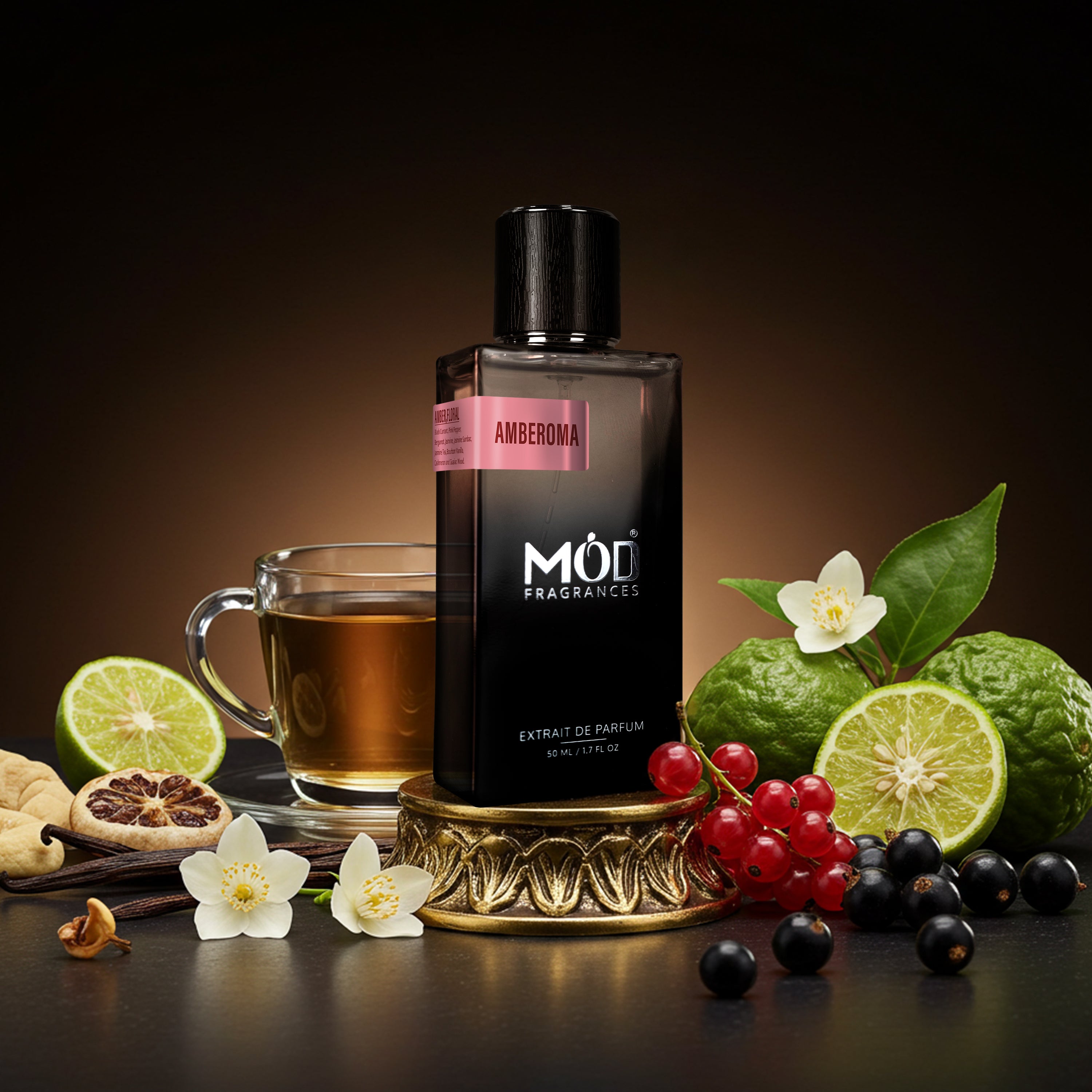 Mod Fragrances ambergris perfume bottle with tea, fruits, and flowers on a dark background