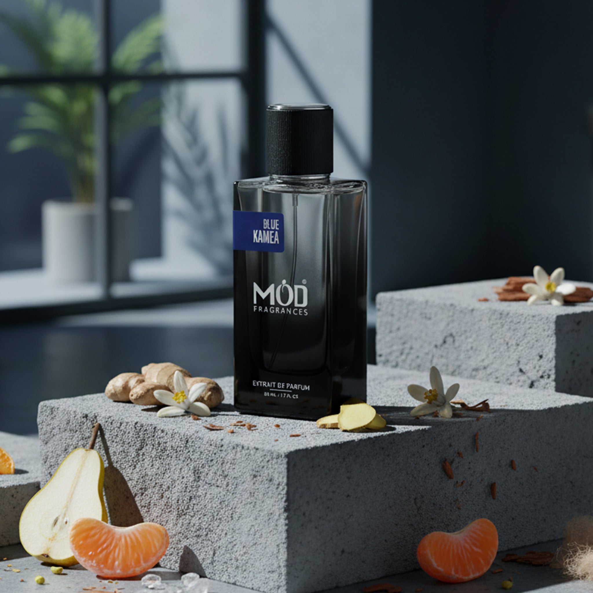 Perfume bottle labeled 'Möd Fragrances' on a concrete surface with fruits and flowers.