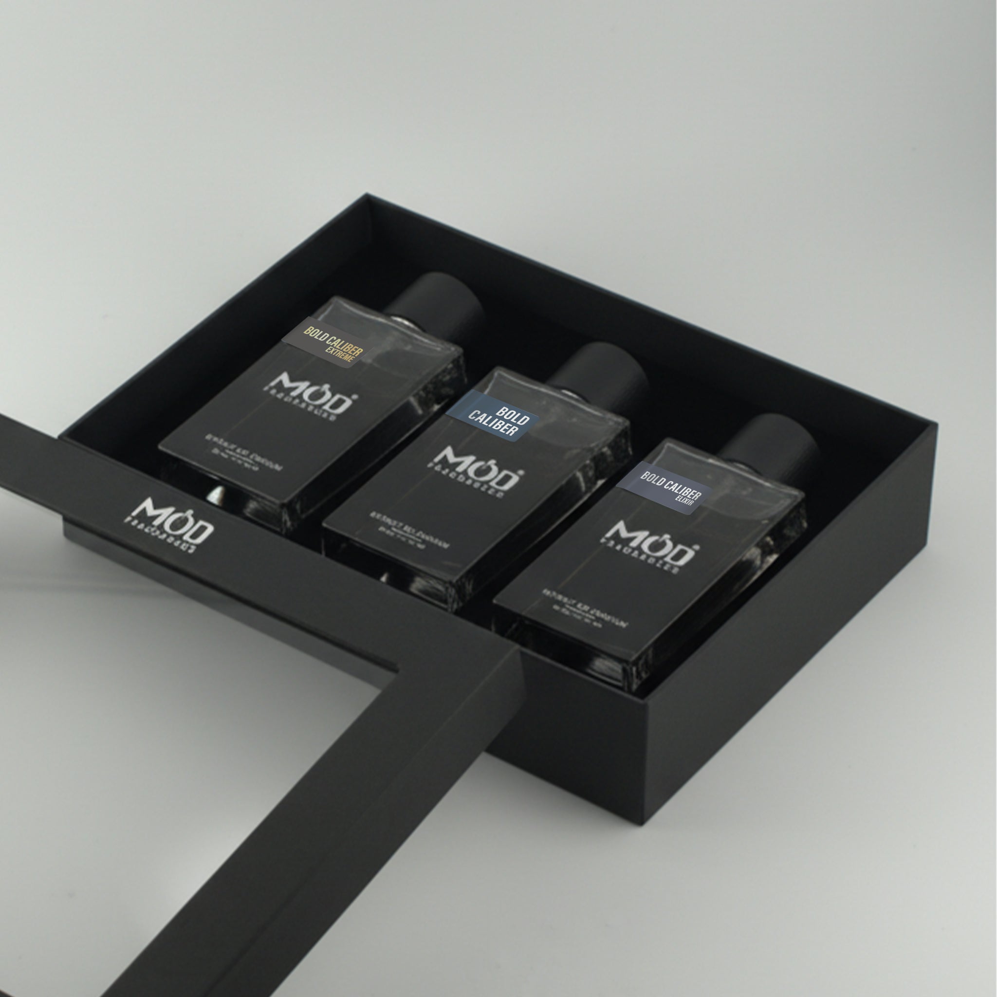 Inspired by Suavage Bundle Pack For Men Three black perfume bottles with 'MOD' branding in a black box on a light gray background