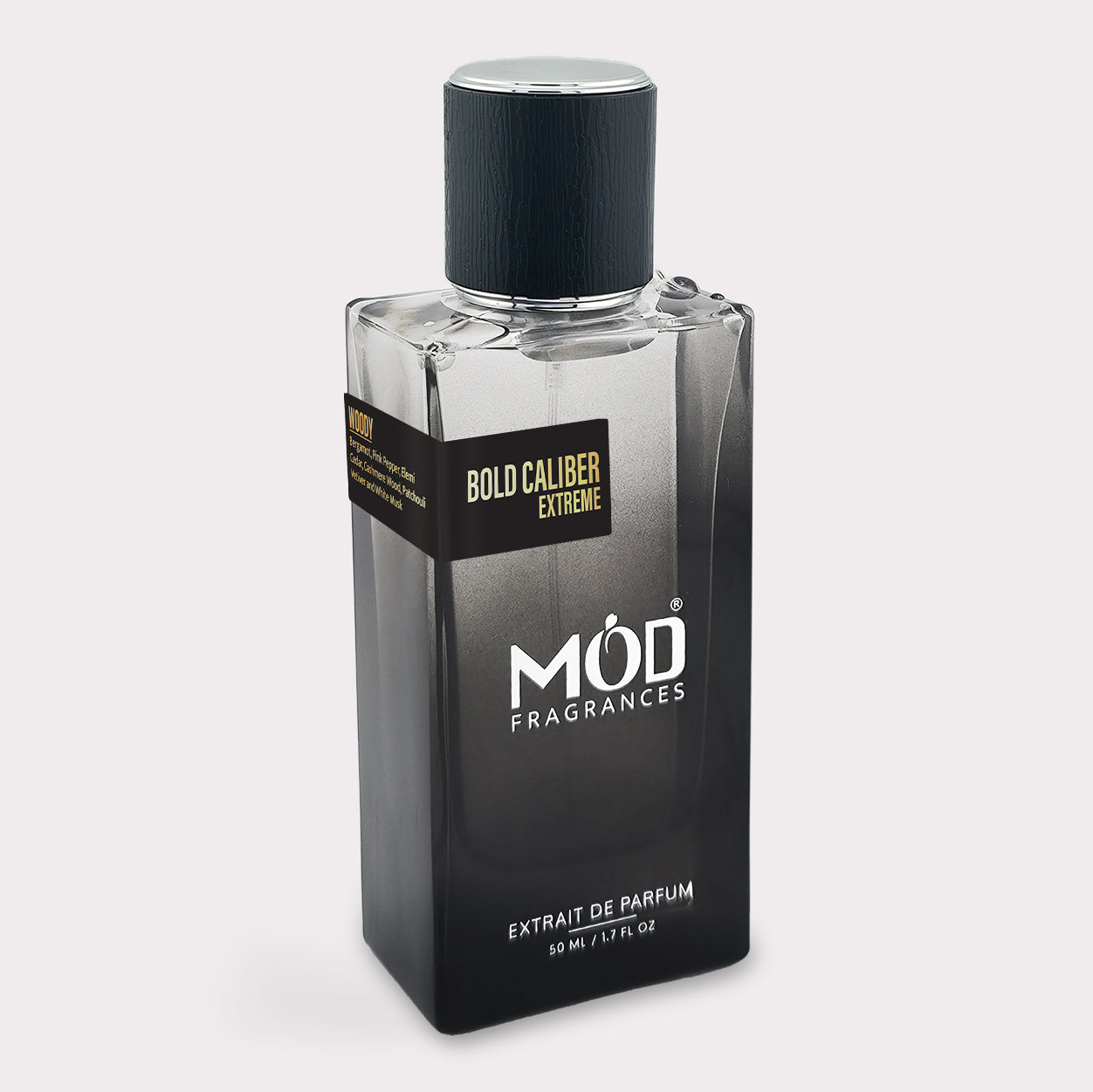 Inspire by Homme EDT Perfume bottle labeled 'Bold Caliber Extreme' by Möd Fragrances on a light gray background