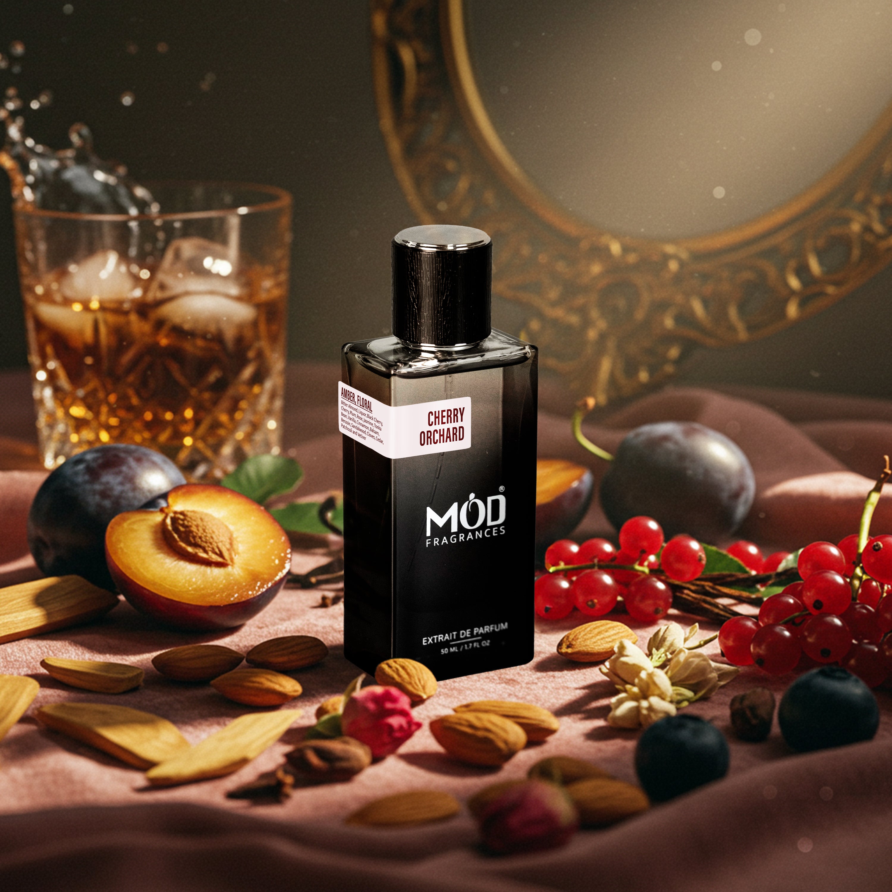 Möd Fragrances Cherry Orchard perfume bottle with fruits and a glass of whiskey on a table.  Inspired by Tom Ford Lost Cherry