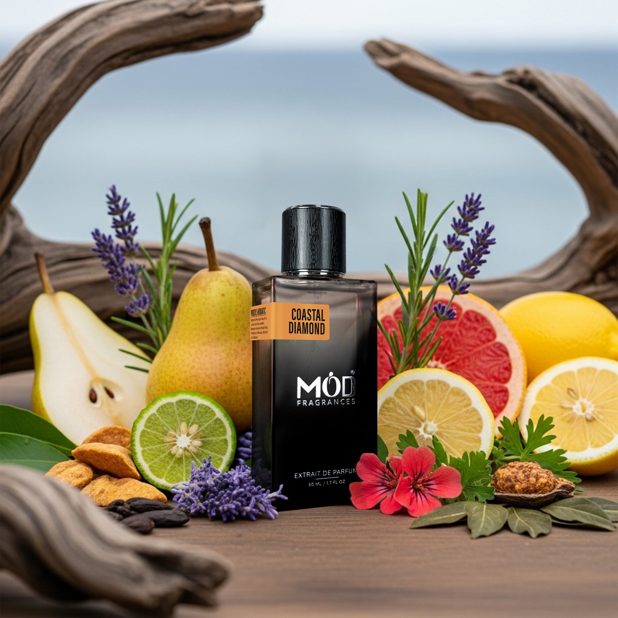Möd Coastal Diamond perfume bottle surrounded by fruits, flowers, and herbs on a wooden surface with a blurred natural background.