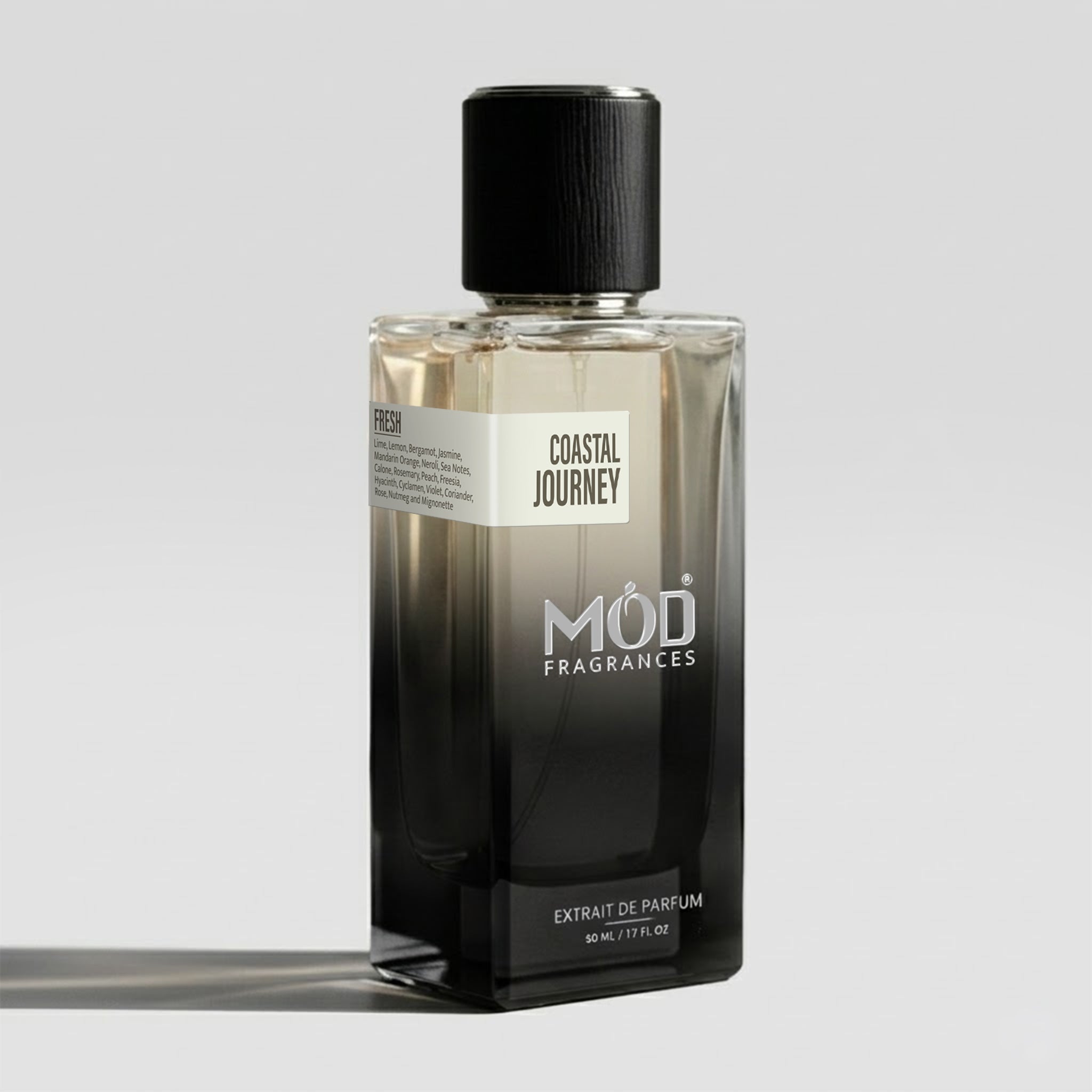 Perfume bottle labeled 'Coastal Journey' by 'Möd Fragrances' on a light gray background