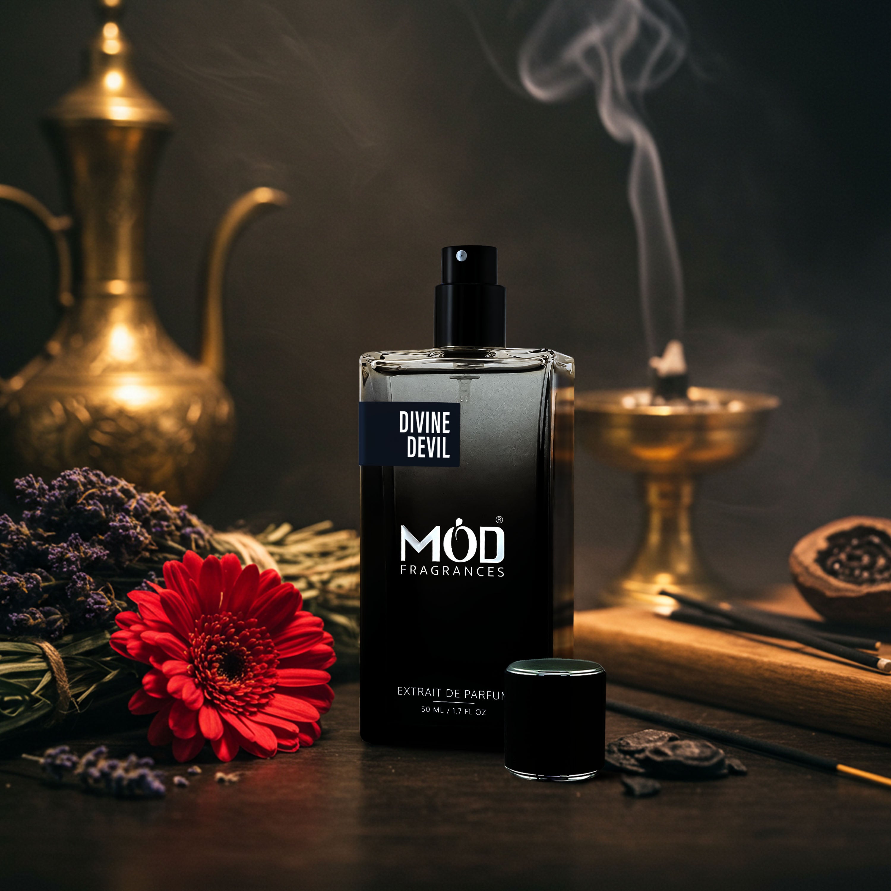 Möd Fragrances Divine Devil perfume bottle with flowers and smoking equipment on a dark background