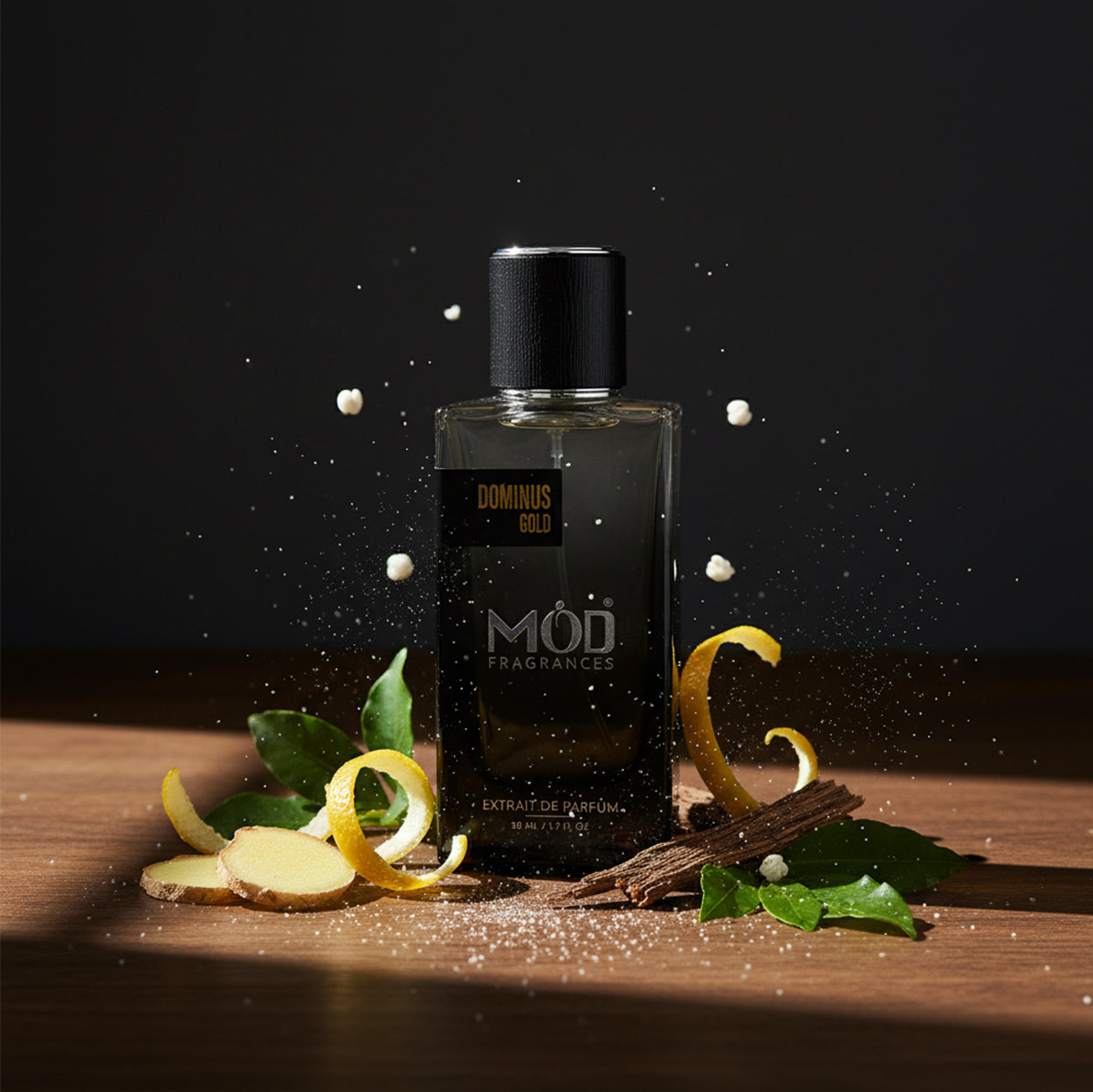 Perfume bottle with vanilla beans and leaves on a wooden surface