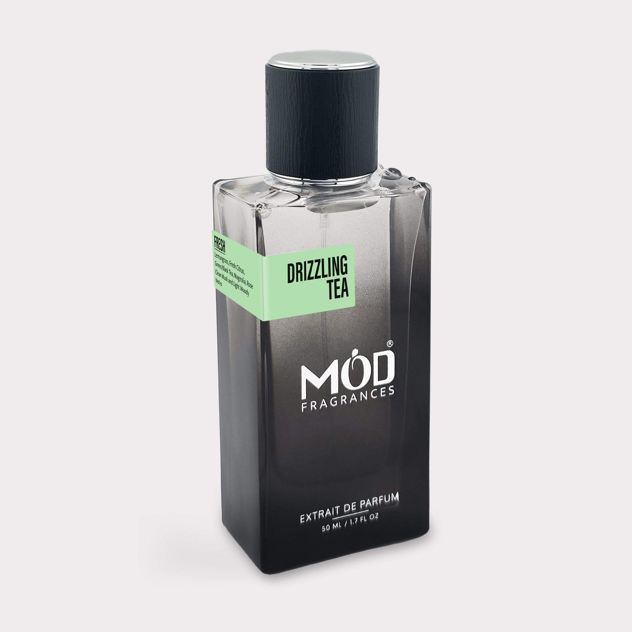 Perfume bottle labeled 'Drizzling Tea' by MOD Fragrances on a light gray background