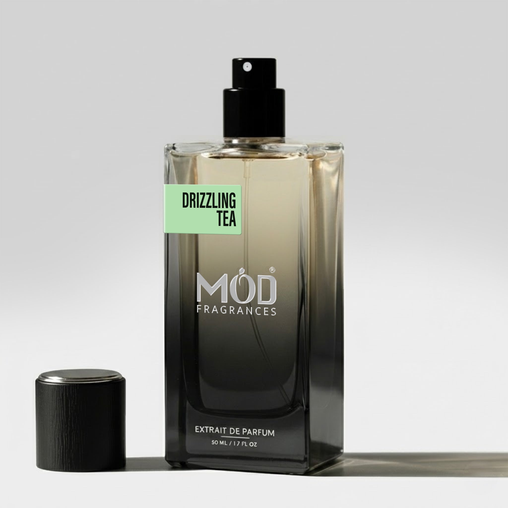 MOD Fragrances 50ml perfume bottle of "drizzling Tea" fresh fragrance for him & her, inspired by Rain Tea, placed vertically on white background.