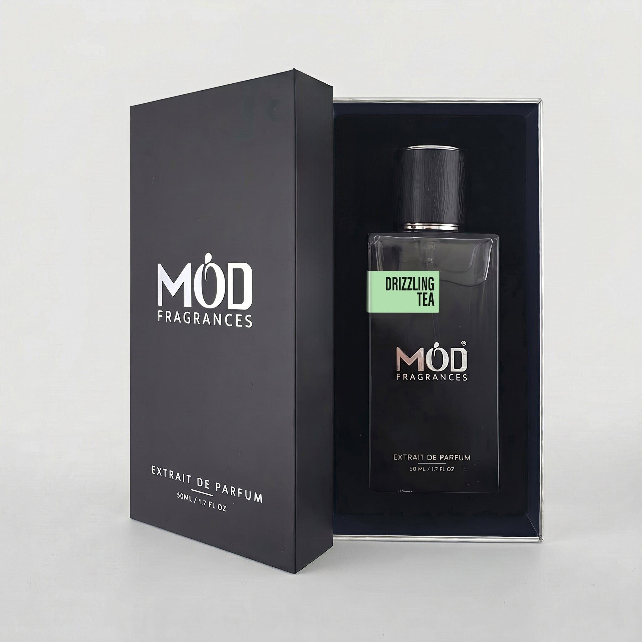 MOD Fragrances 50ml perfume bottle and premium box of "drizzling Tea" fresh fragrance for him & her, inspired by Rain Tea, placed vertically on white background.
