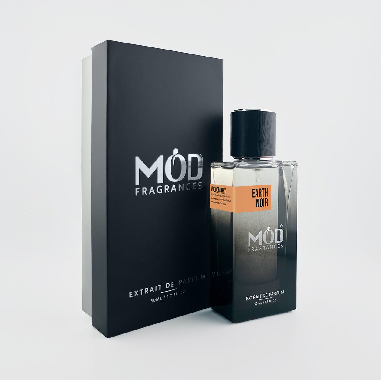 Möd Fragrances Earth Noir perfume bottle and packaging on a light gray background