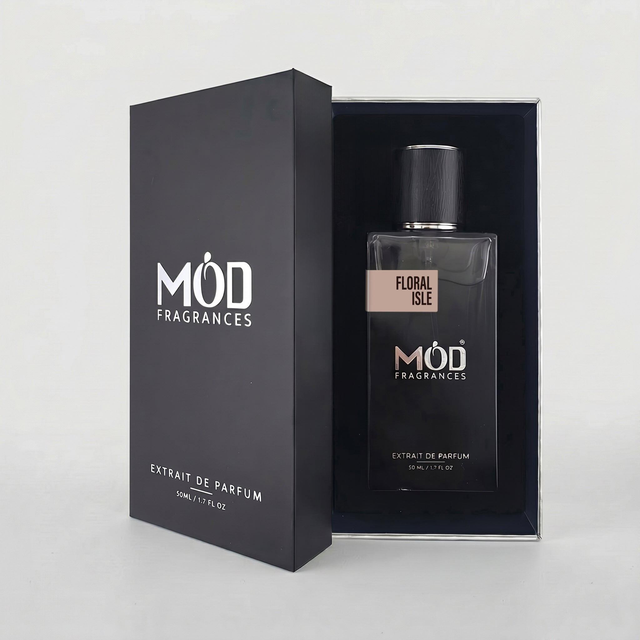 An open premium black perfume box reveals a rectangular glass bottle labeled “Floral Isle” by MOD Fragrances, resting securely in a black-lined presentation case.