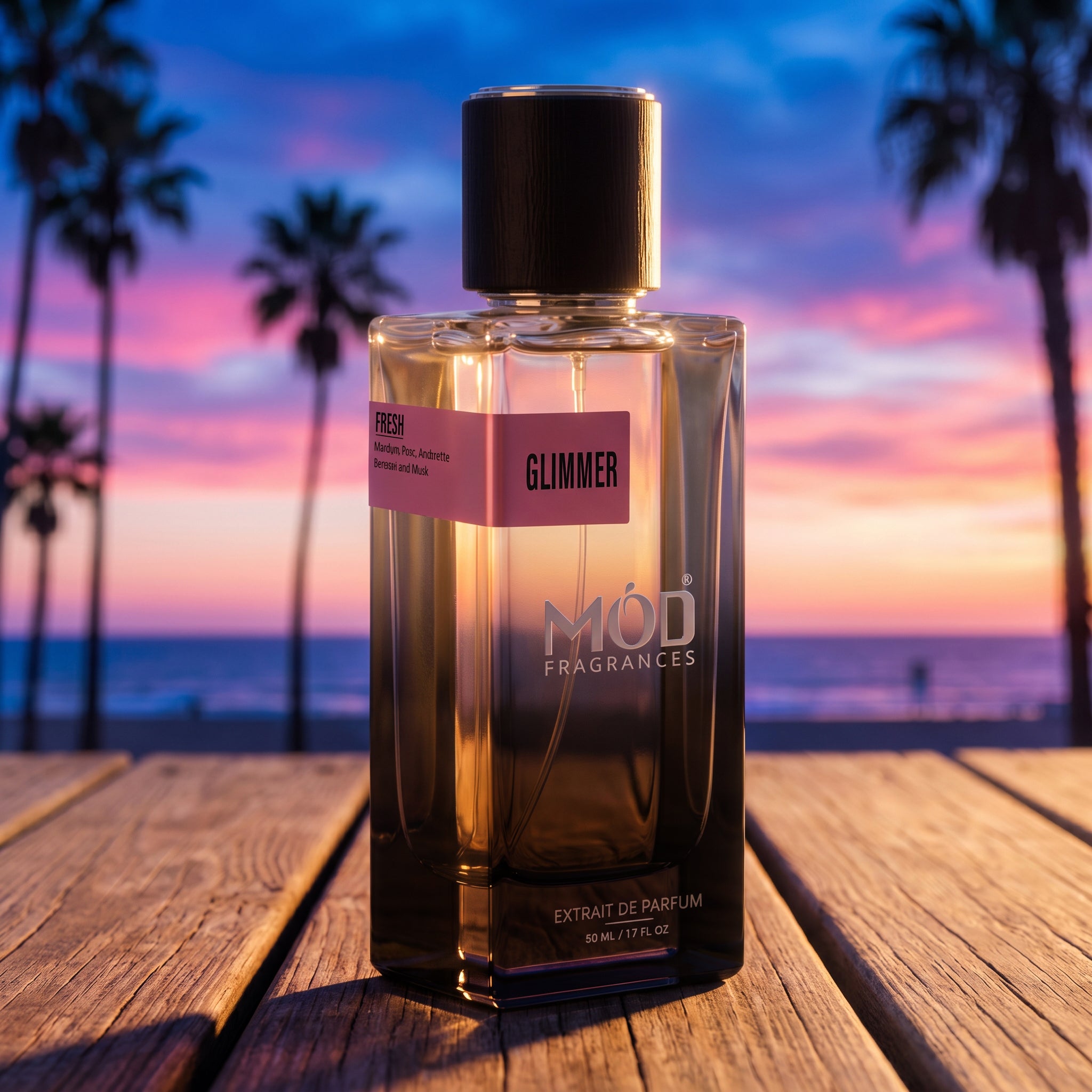 A rectangular glass perfume bottle by MOD Fragrances, labeled "Glimmer" is placed on wooden deck near beach of California, evening time, GTA vibe, Vice city theme vibe and colors.