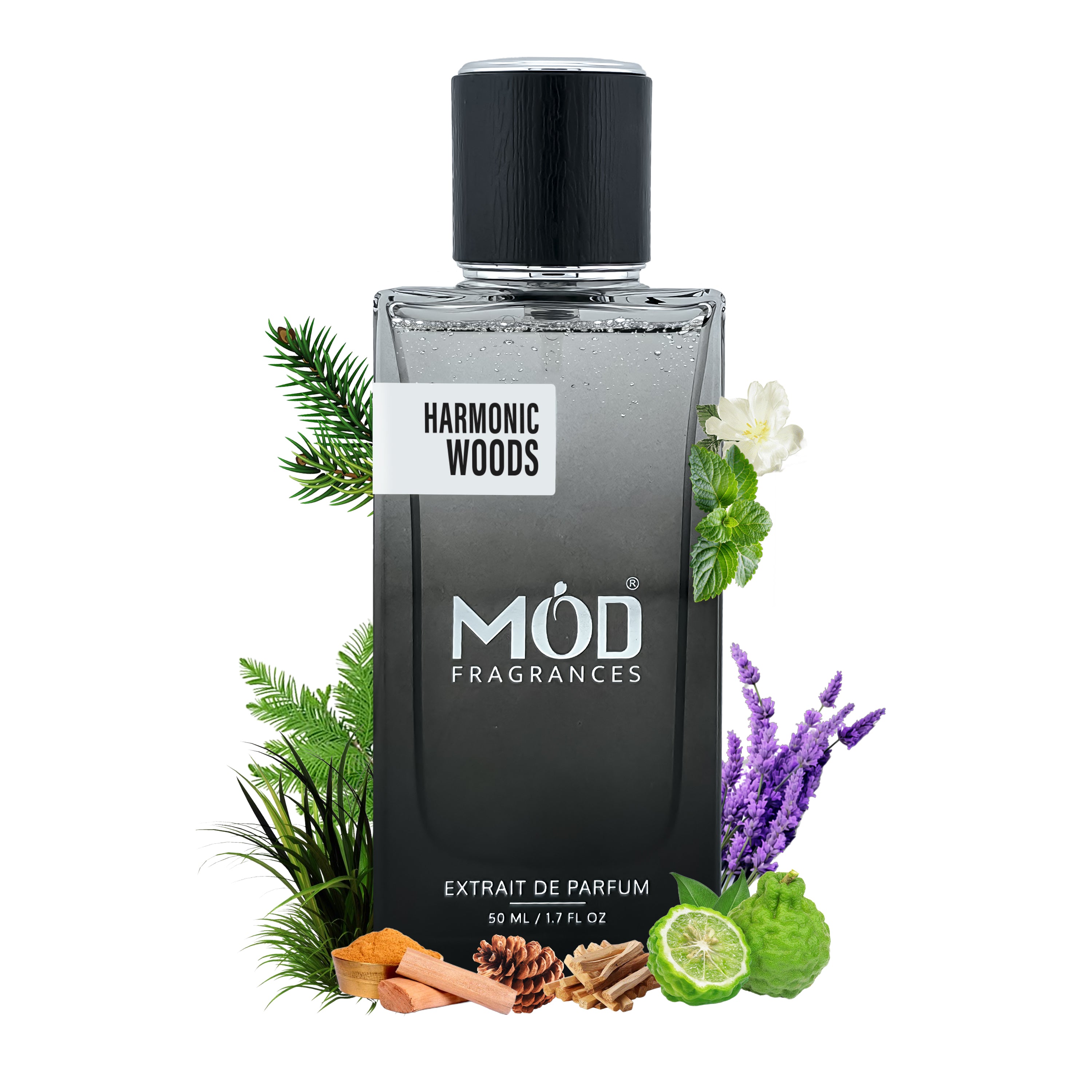 A bottle of MOD Fragrances 'Harmonic Woods' extrait de parfum, styled with botanical and spice props including pine branches, mint, white flowers, lavender, ginger, cinnamon, and a lime on a solid white background.