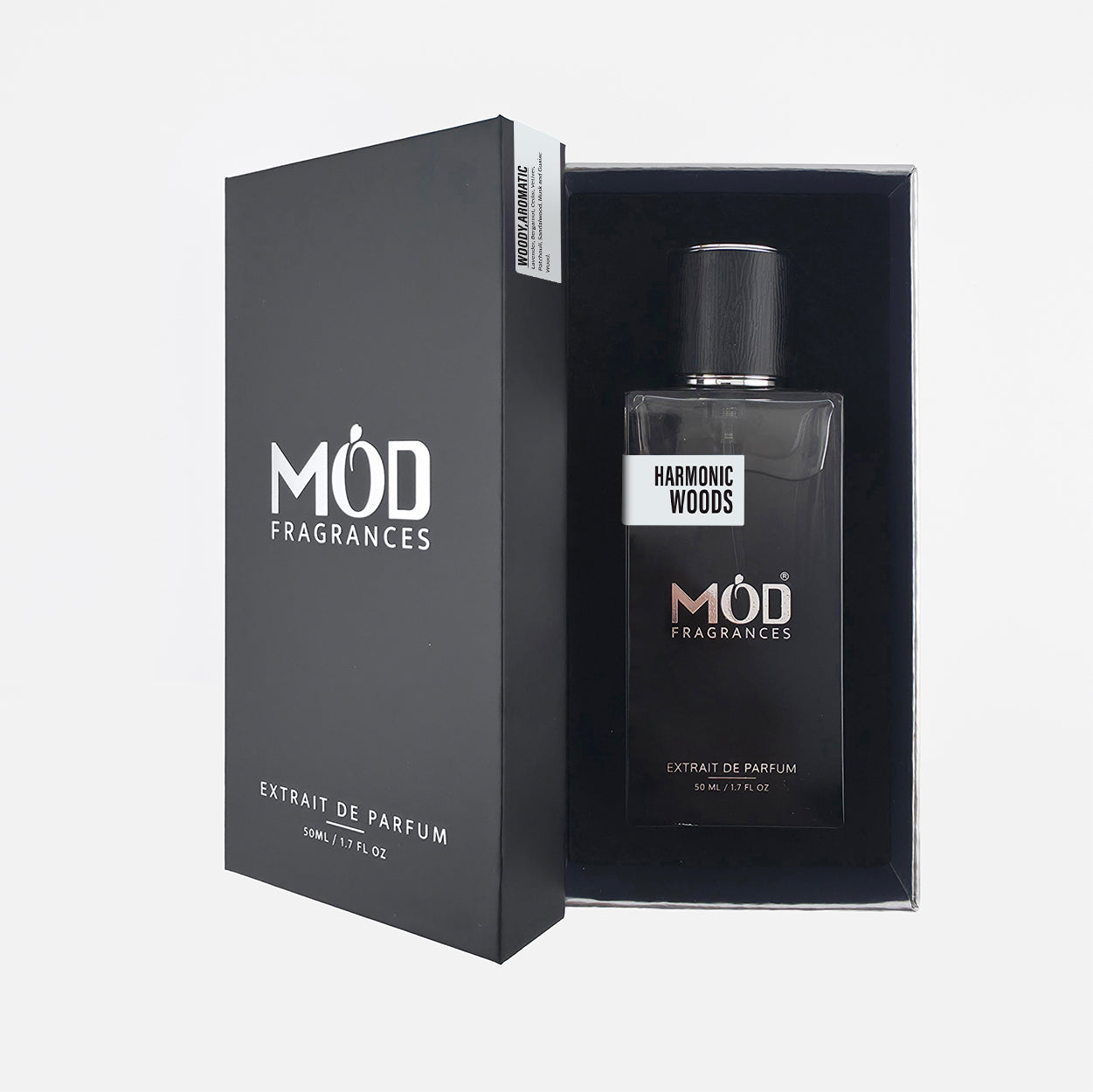 MOD Fragrances Harmonic Woods Extract de Parfum bottle displayed next to its black presentation box on a light gray background.