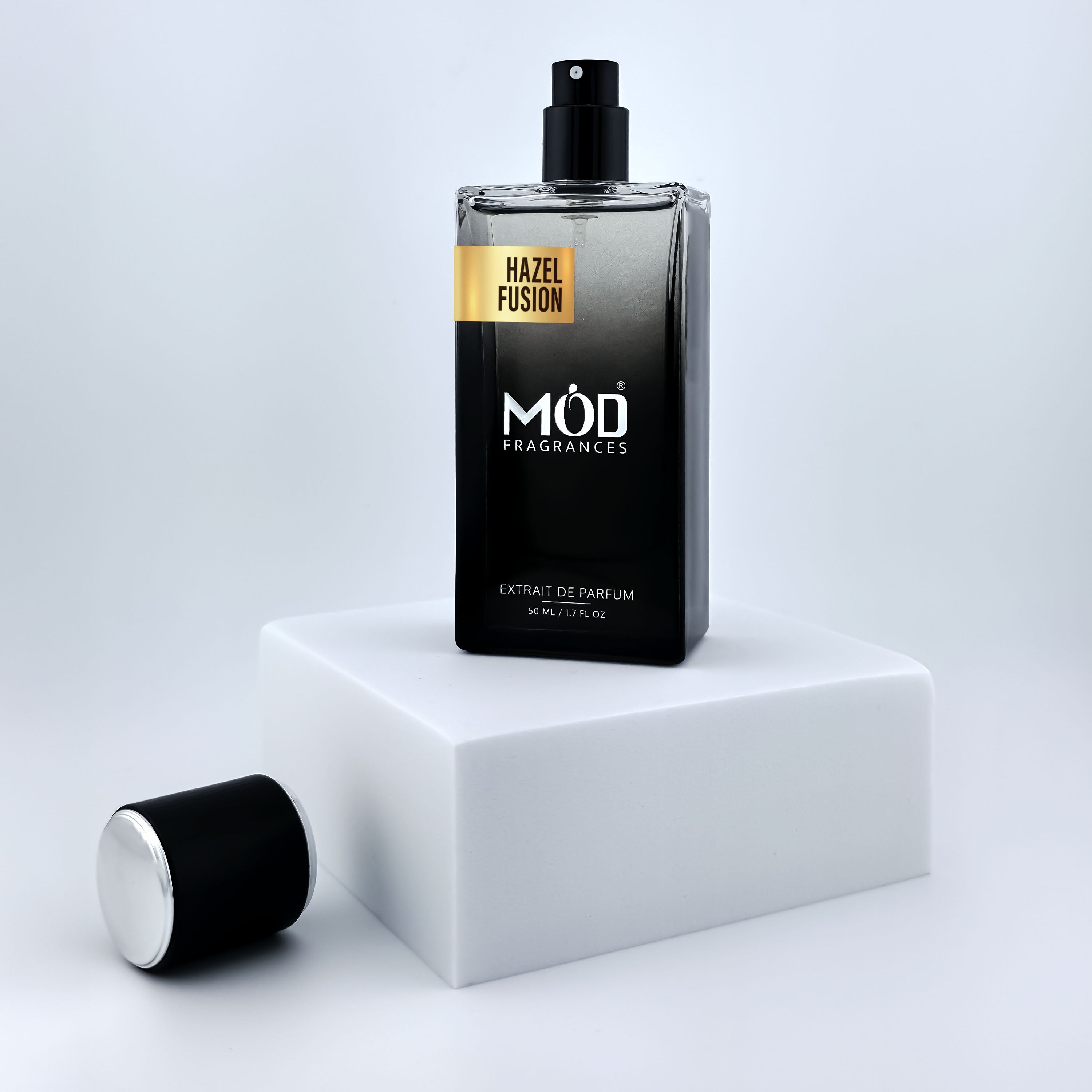 Perfume bottle with 'MOD Fragrances' branding on a white platform