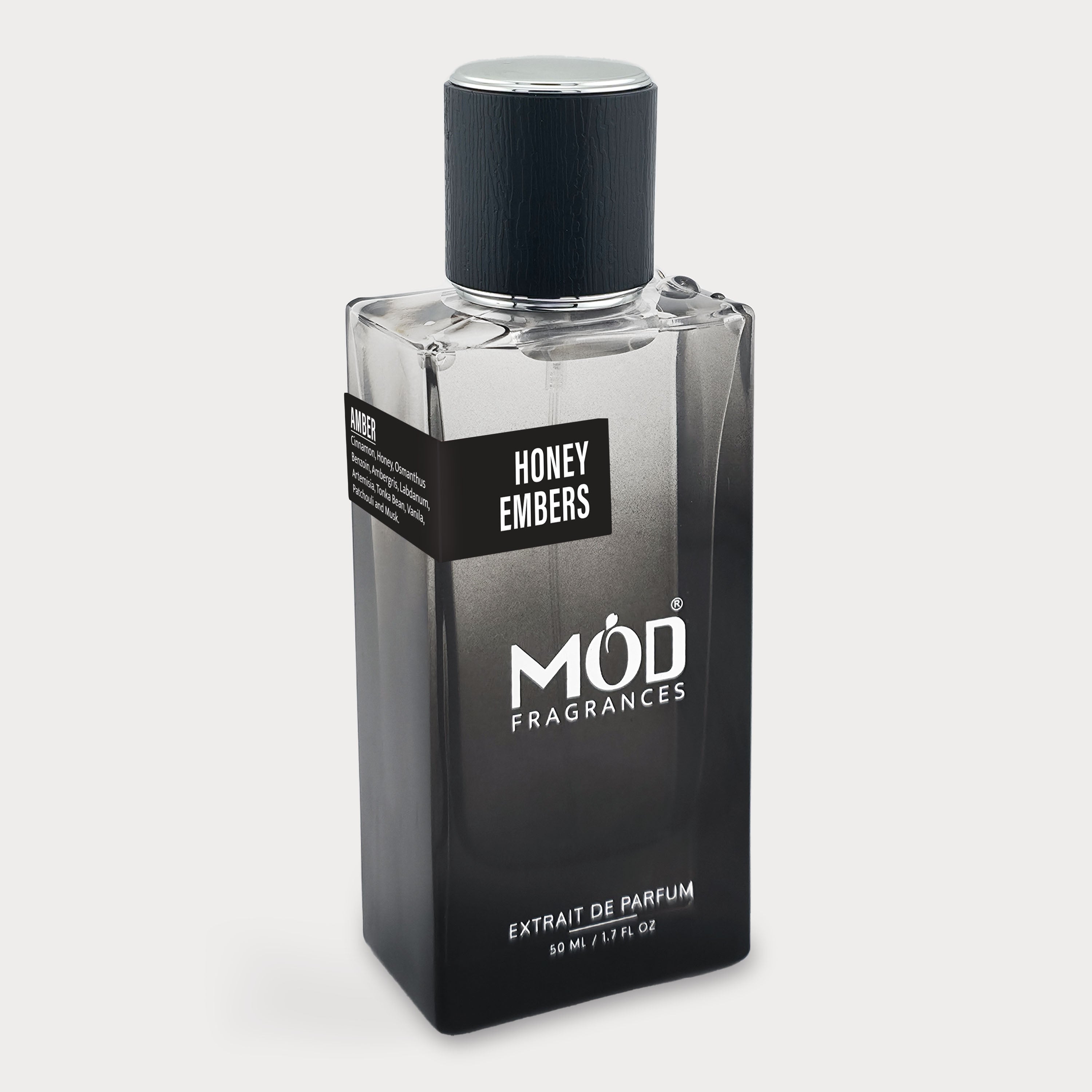 Perfume bottle labeled 'Honey Embers' by MOD Fragrances on a light gray background