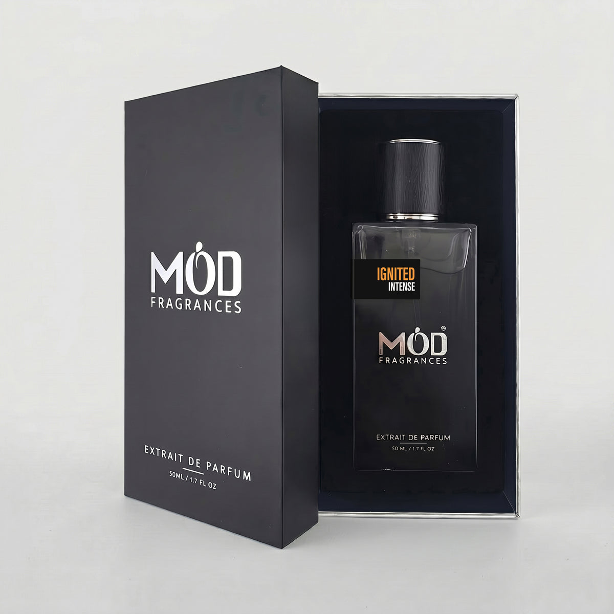 MOD Fragrances Enigmatic Extrait de Parfum 50ml bottle displayed next to its black presentation box on a light gray background.