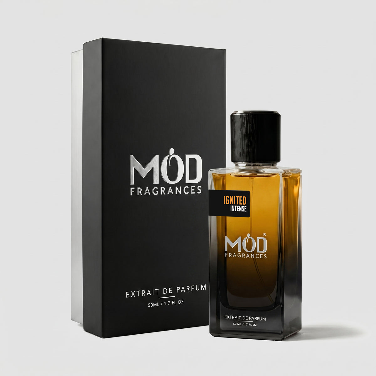 A bottle of MOD FRAGRANCES Igniter Intense extrait de parfum next to its black packaging box, set against a light gray background.
