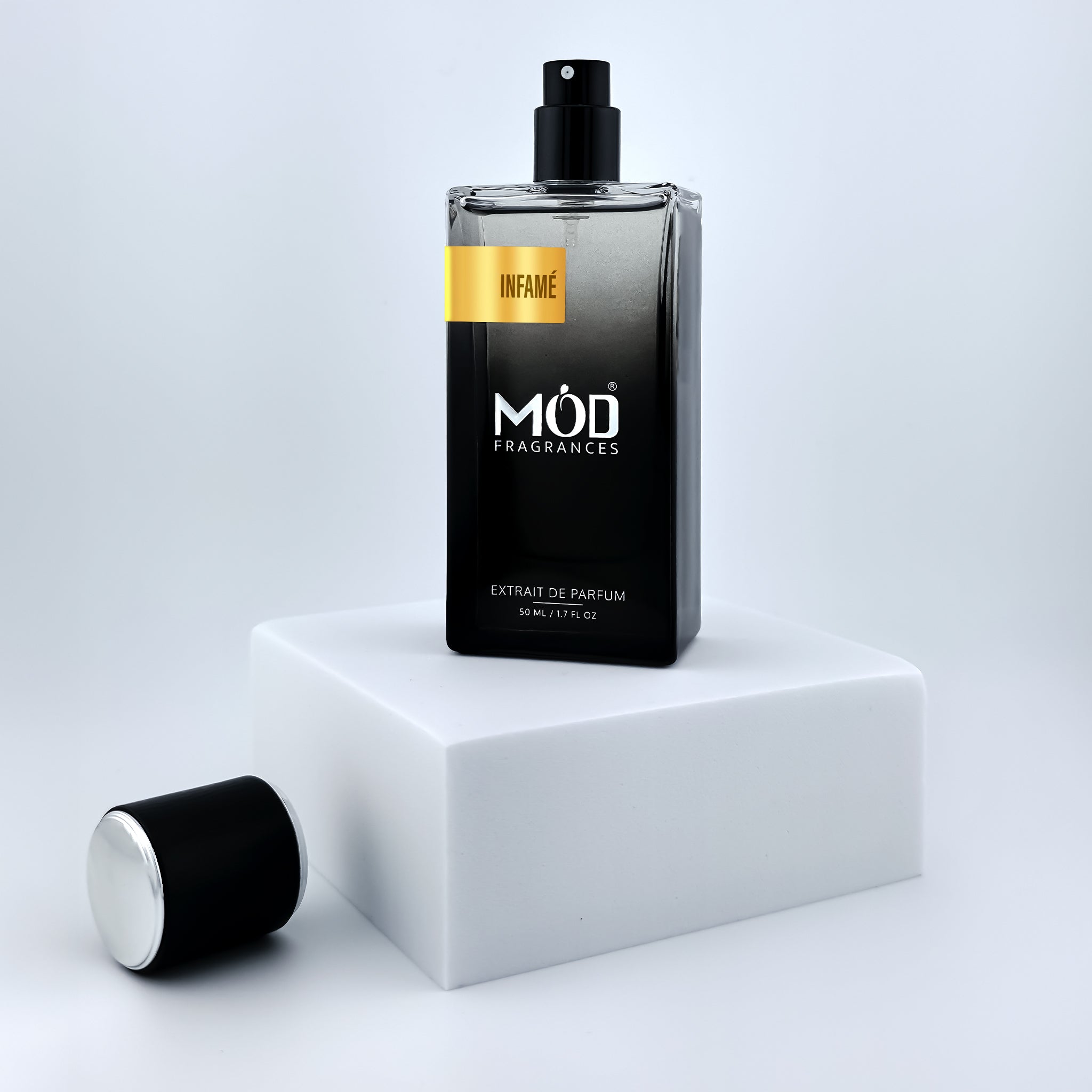 Black perfume bottle with 'Möd Fragrances' on a white platform