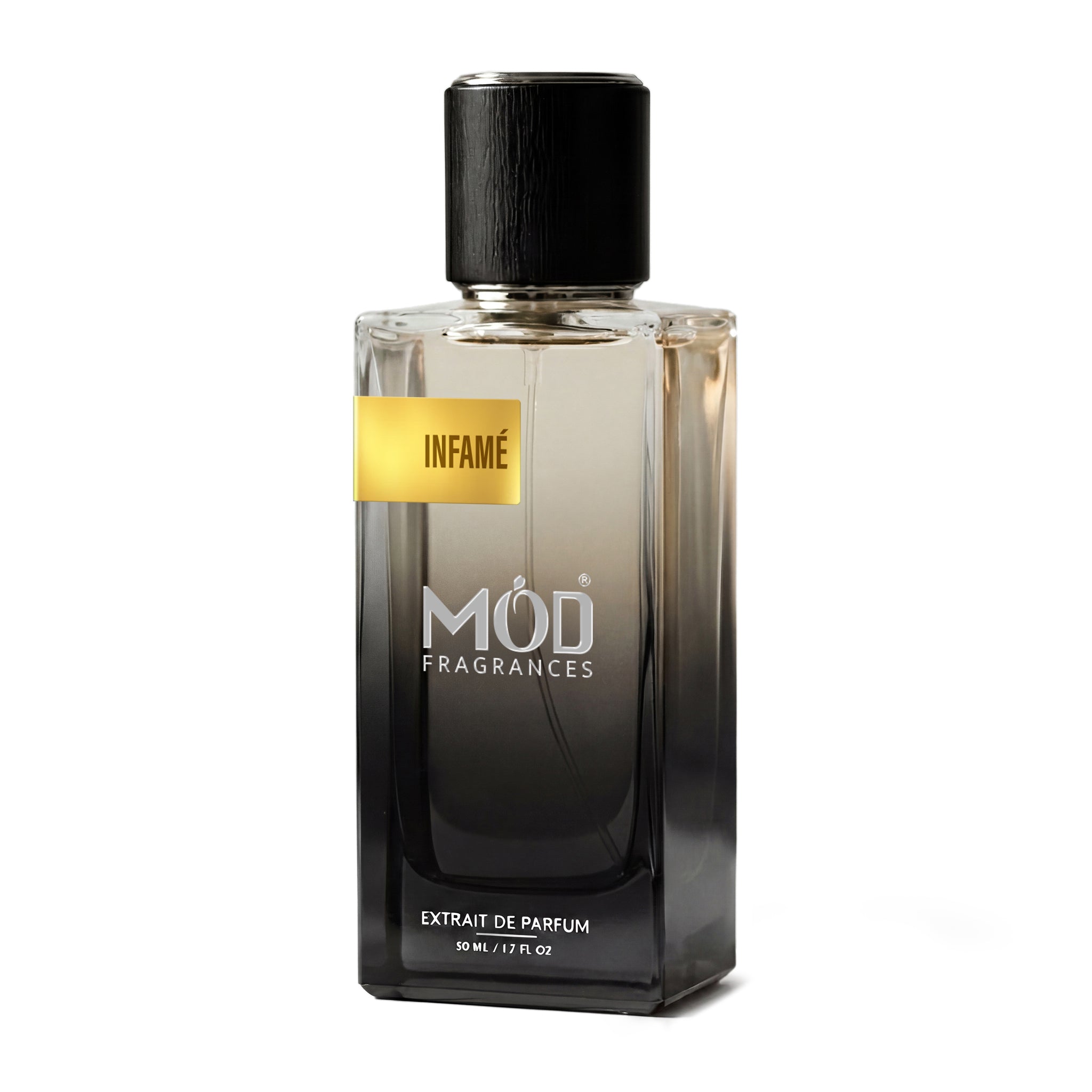 A rectangular glass perfume bottle by MOD Fragrances, labeled “Infame” stands centered against a plain white background, featuring a black cap and a gradient black-to-clear glass finish.