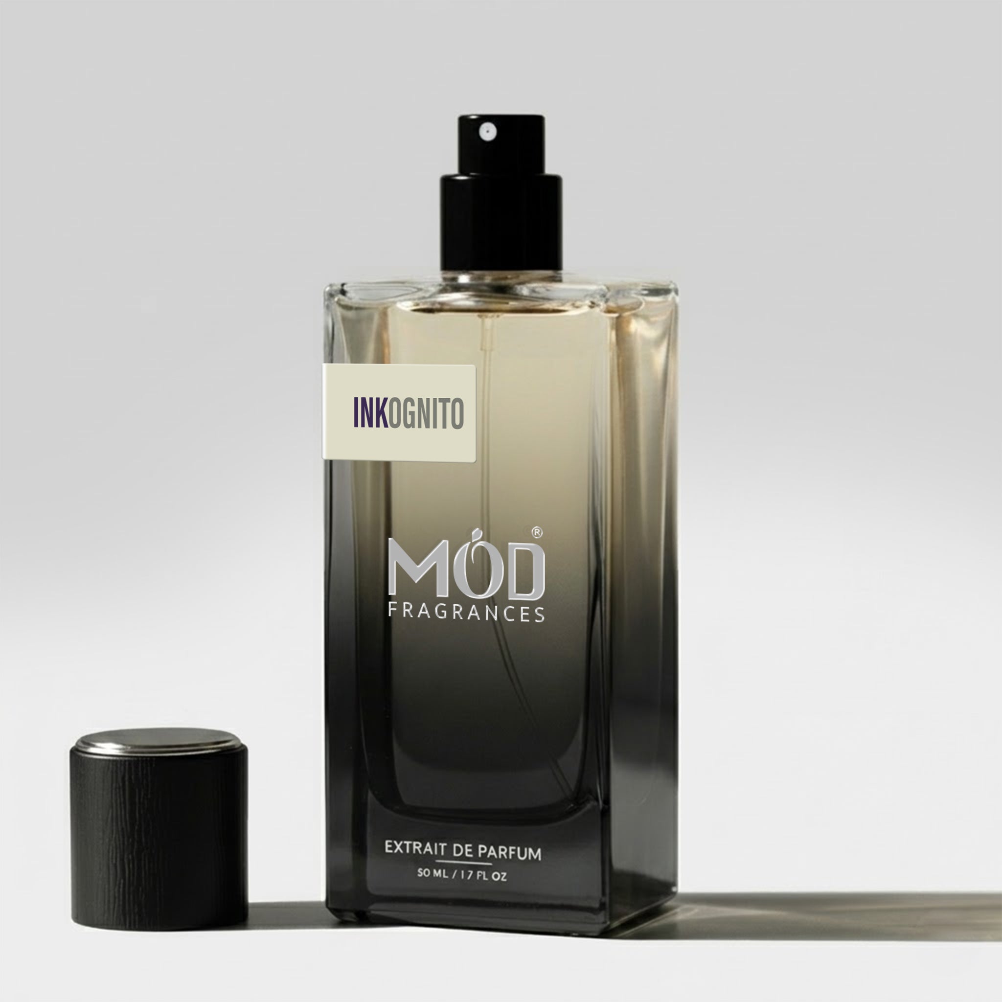 Perfume bottle labeled 'Inkognito' by 'MOD Fragrances' on a light gray background