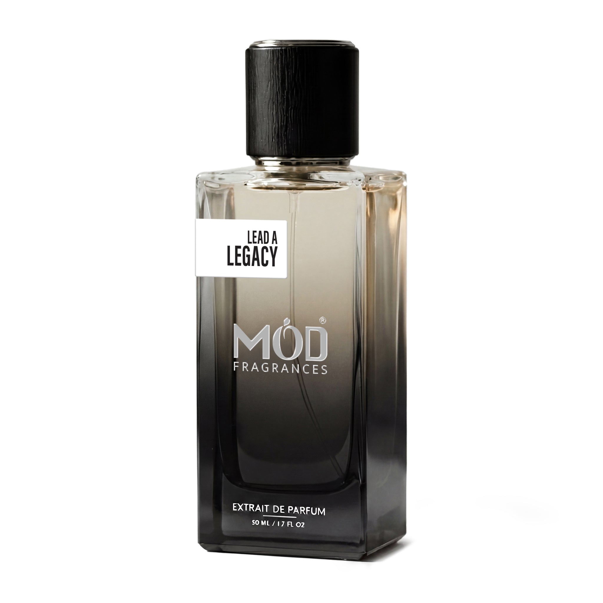 A rectangular glass perfume bottle by MOD Fragrances, labeled “Lead A Legacy” stands centered against a plain white background, featuring a black cap and a gradient black-to-clear glass finish.