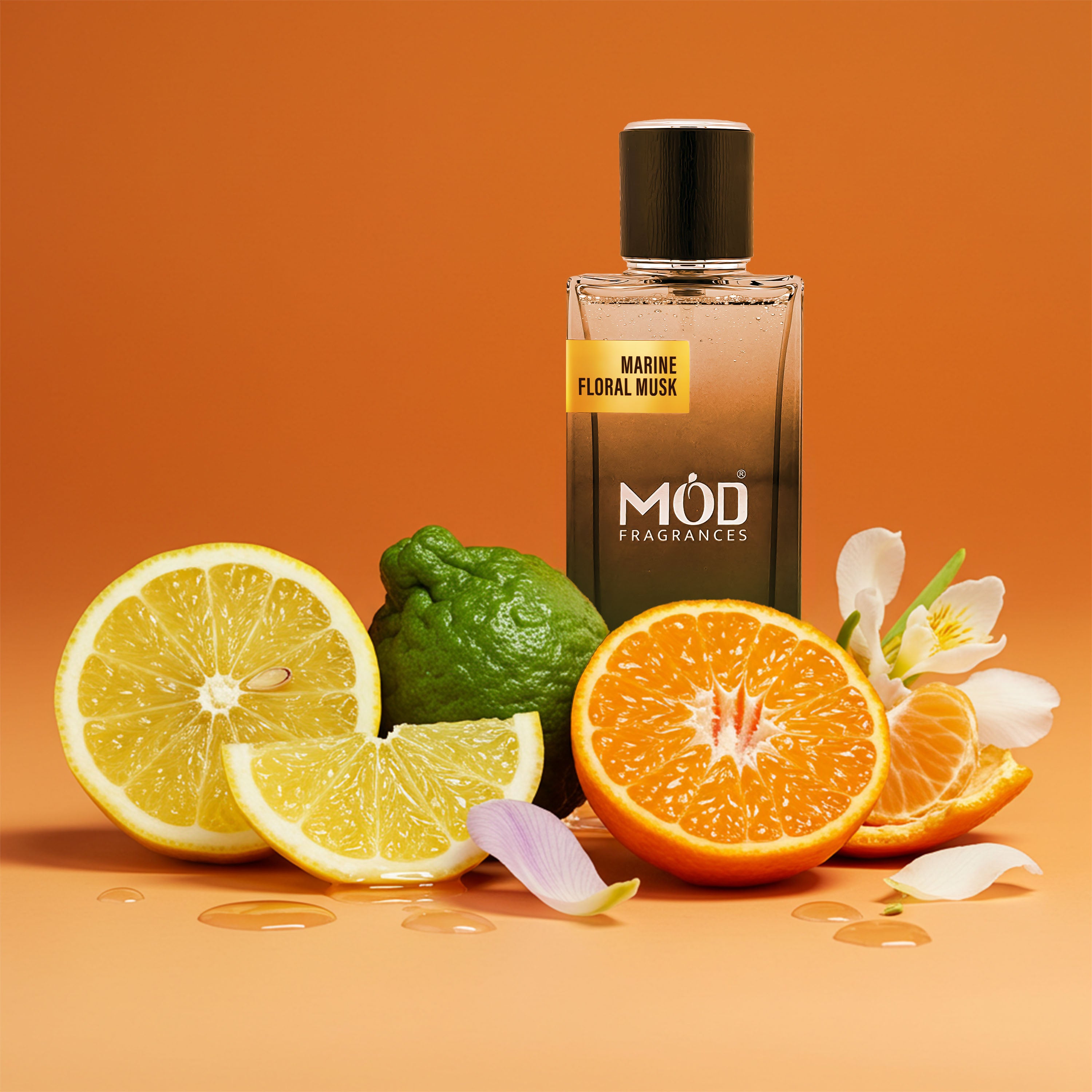 Möd Fragrances Marine Floral Musk perfume bottle with citrus fruits and flowers on an orange background