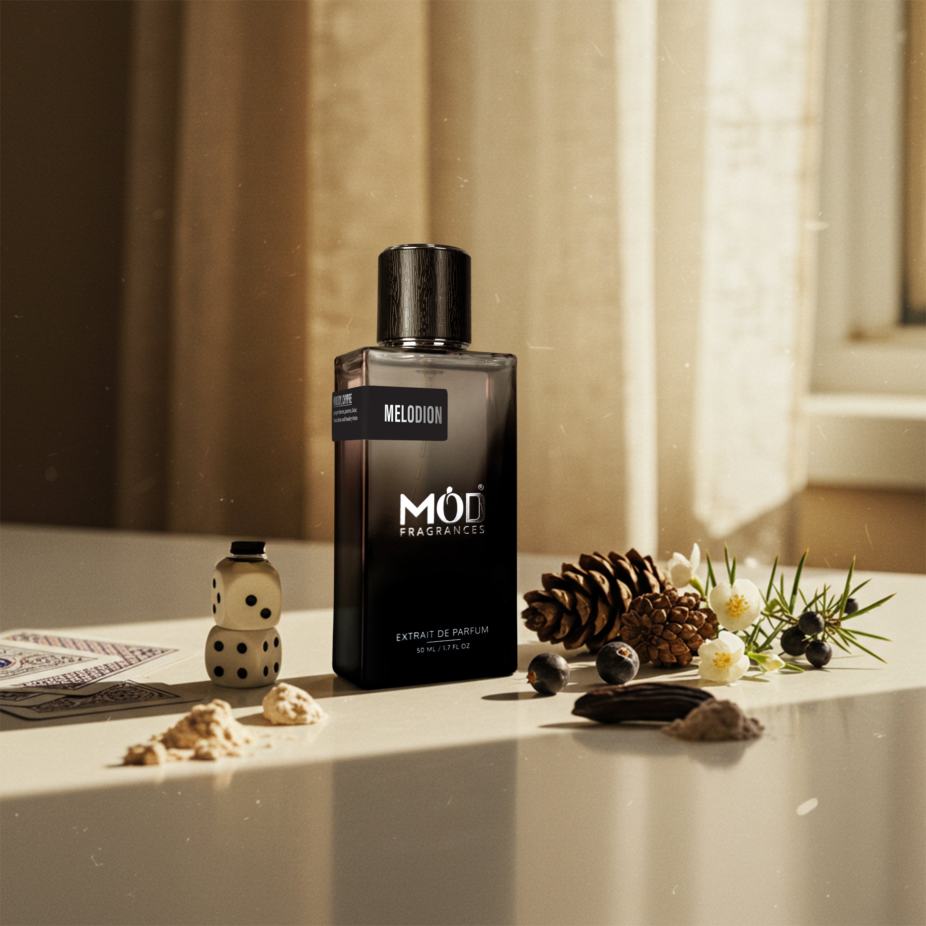 Black Möd perfume bottle on a surface with decorative elements