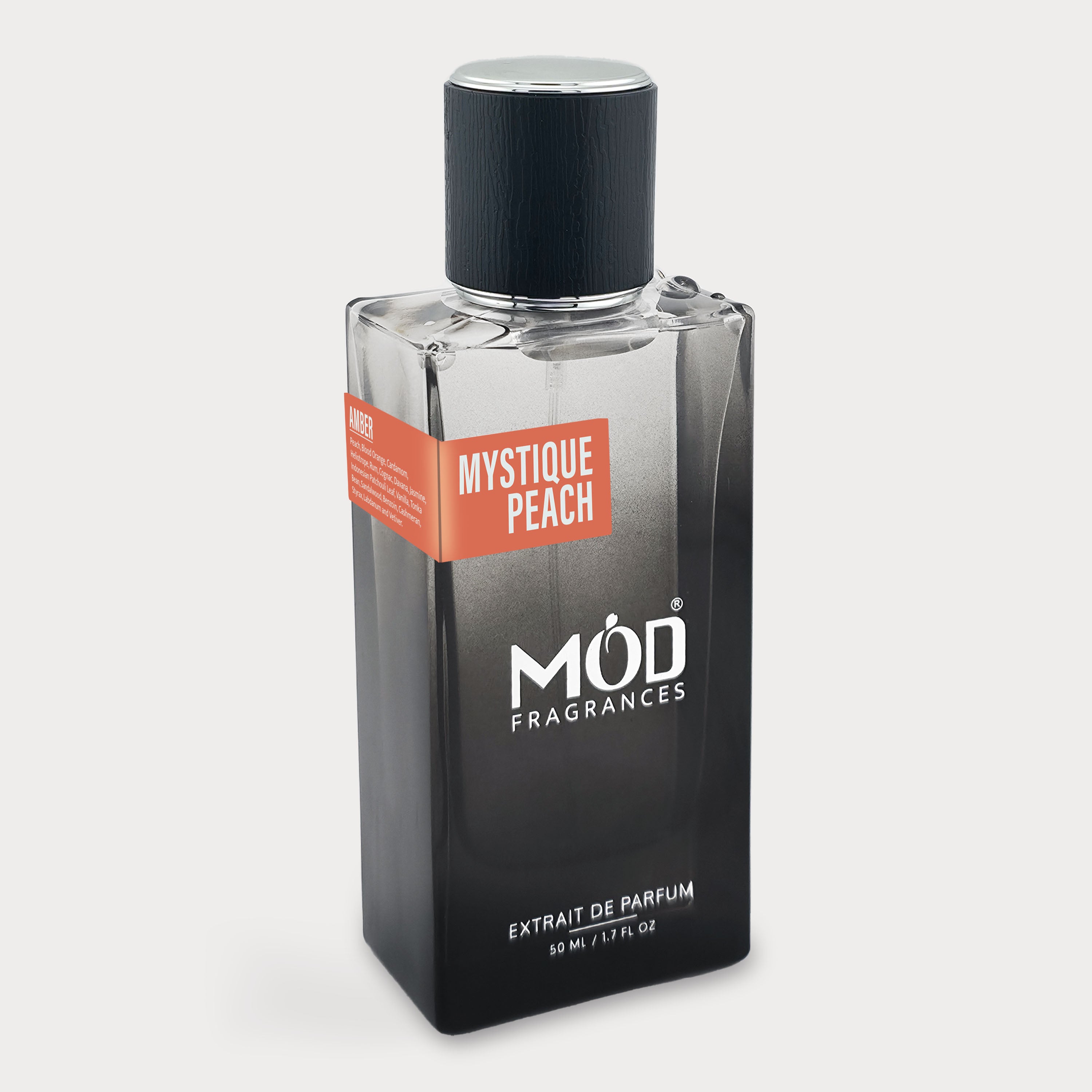 Mystique Peach perfume bottle by MOD Fragrances on a light gray background