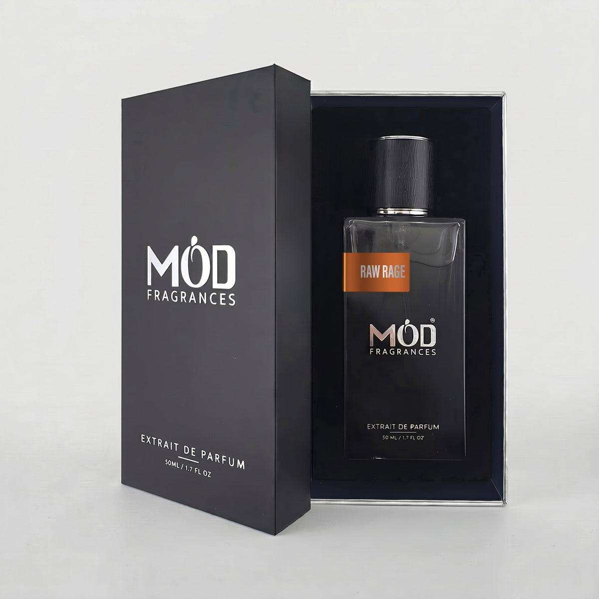 An open premium black perfume box reveals a rectangular glass bottle labeled “Raw Rage” by MOD Fragrances, resting securely in a black-lined presentation case.