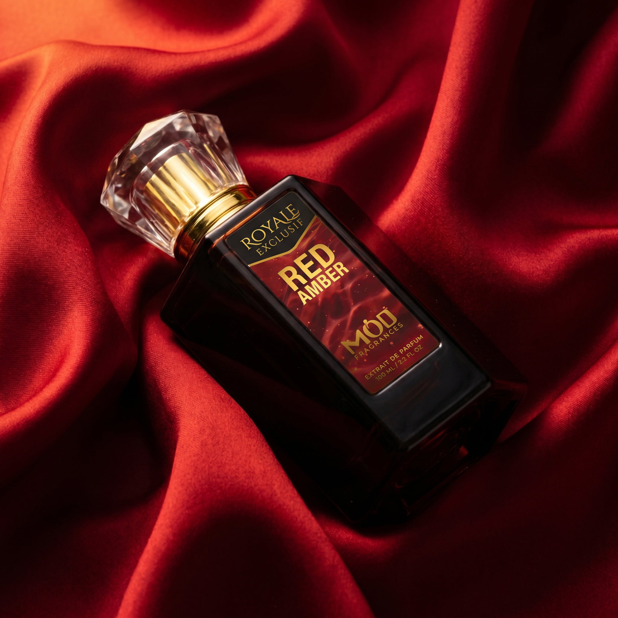 Royale Exclusif Red Amber by MOD fragrance, 100ml luxury black bottle nestled inside crimson red satin silk