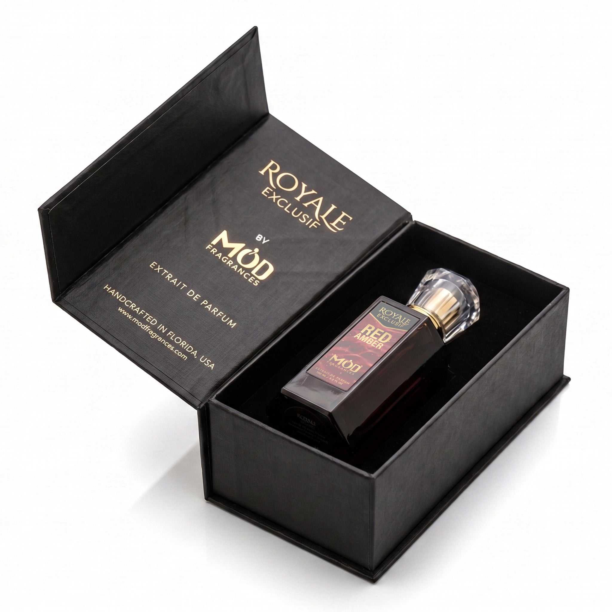 Royale Exclusif Red Amber by MOD fragrance, 100ml luxury black box and bottle laying on white background