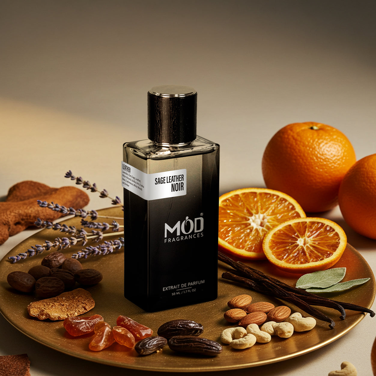 Sage Leather Noir perfume bottle on a plate with oranges, nuts, and spices