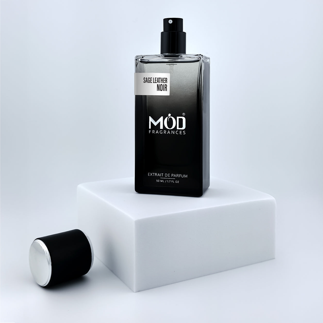 Perfume bottle labeled 'MØD Fragrances' on a white platform with a light gray background