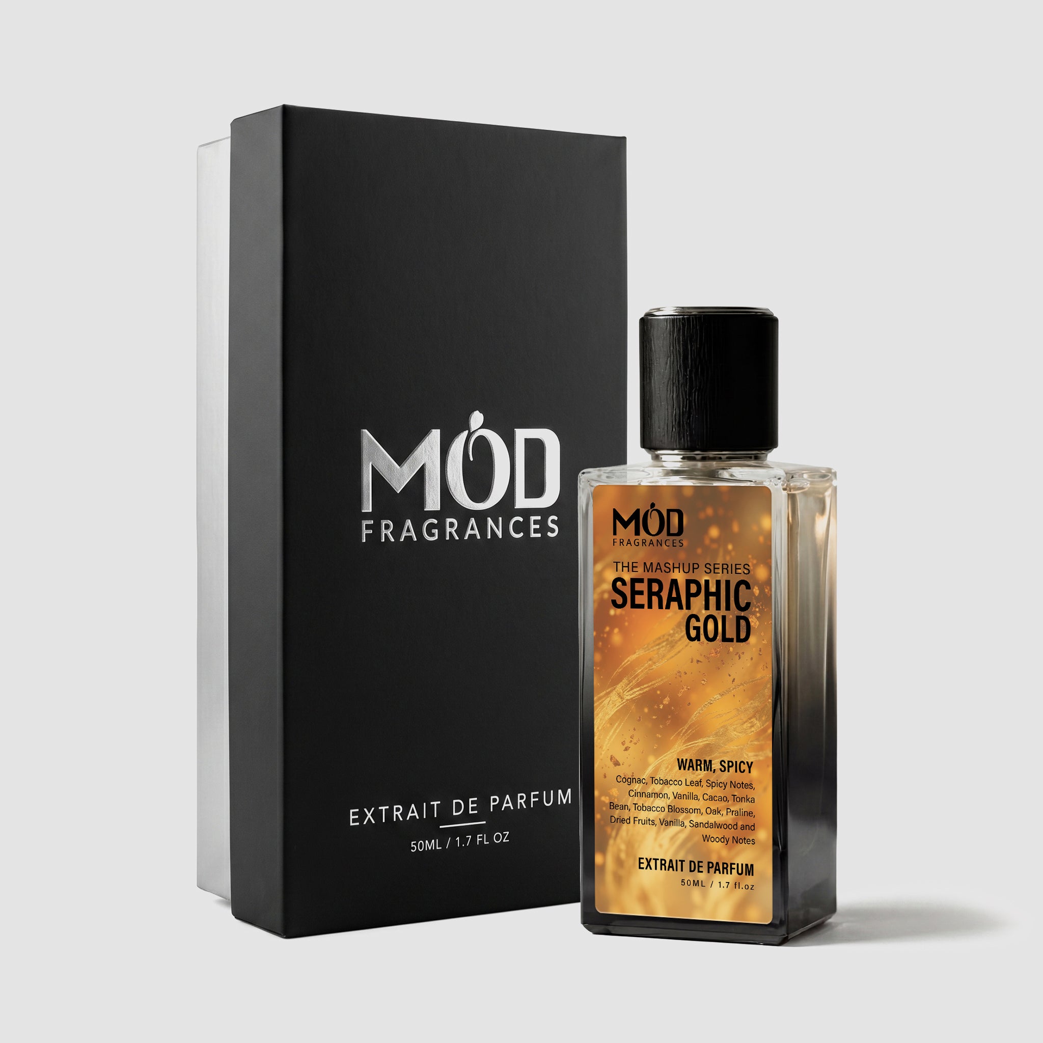 A rectangular perfume bottle by MOD Fragrances, labeled "Mashup series Seraphic Gold" is positioned next to its closed, upright premium black display box on a light grey background.