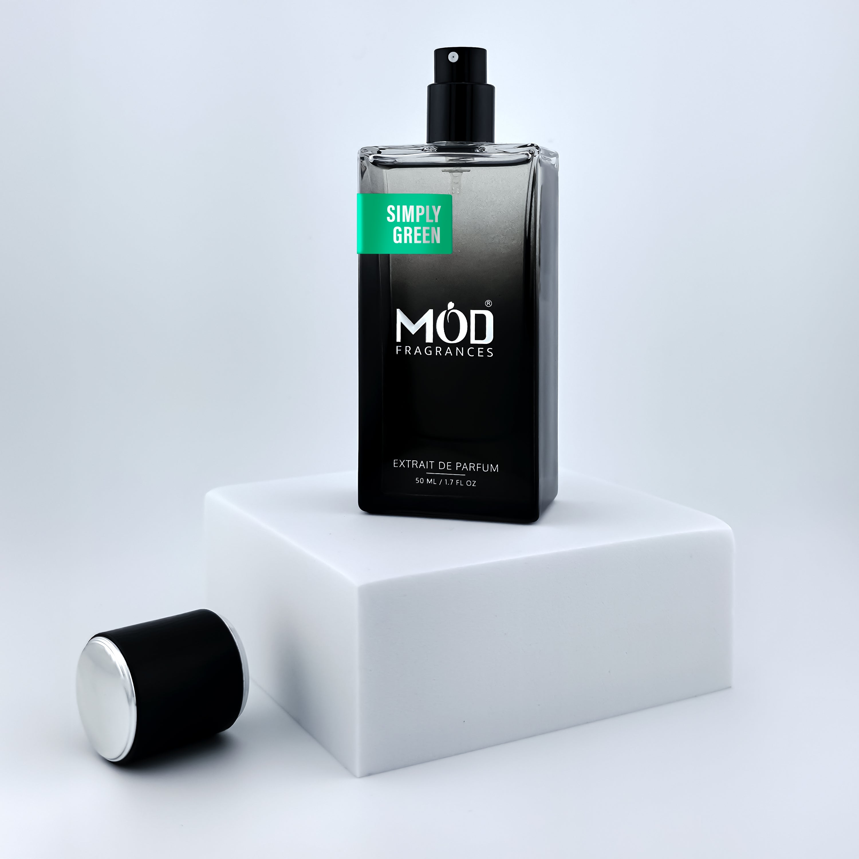 Perfume bottle labeled 'MOD Fragrances' on a white platform with a light gray background