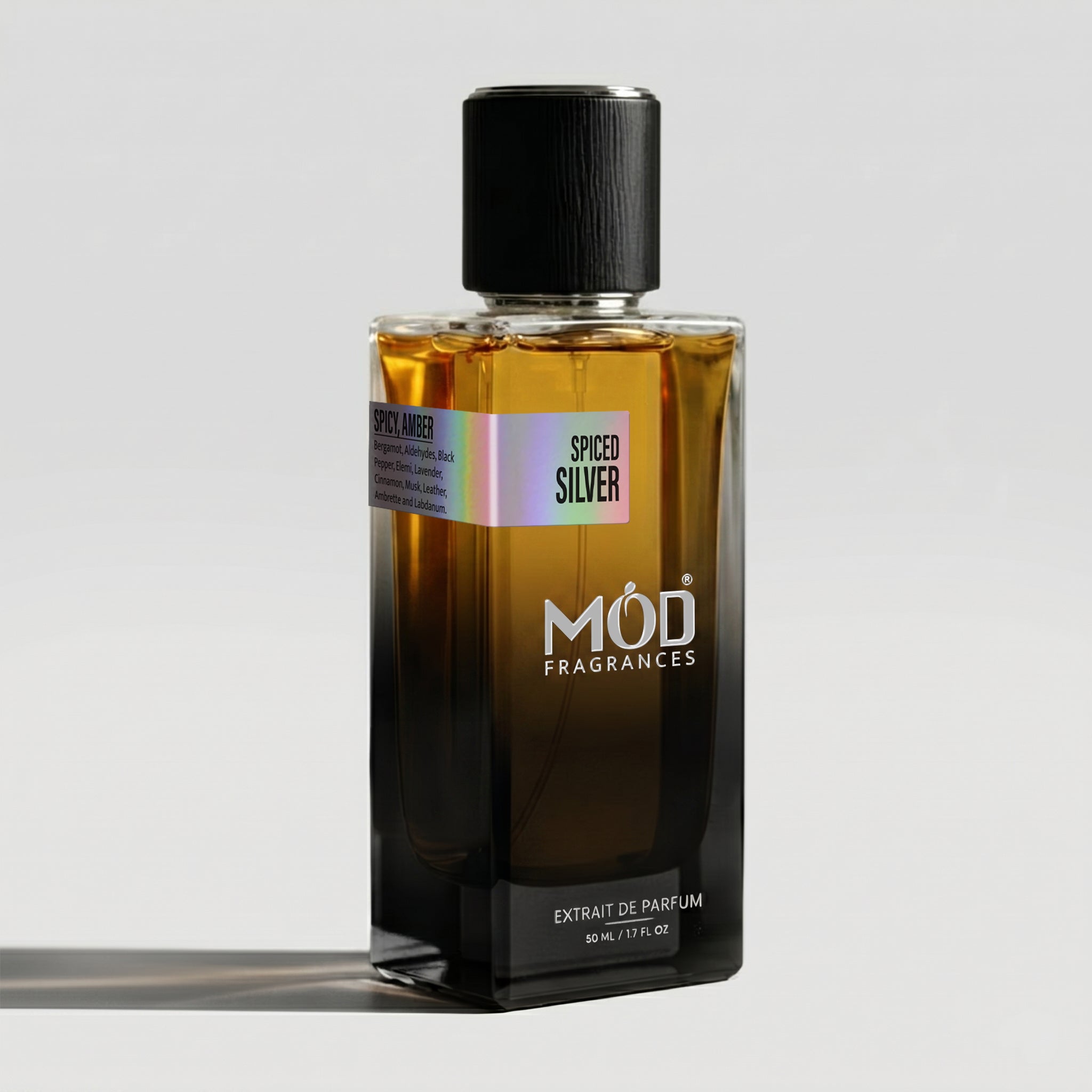 Perfume bottle labeled 'Spiced Silver' by MOD Fragrances on a light gray background