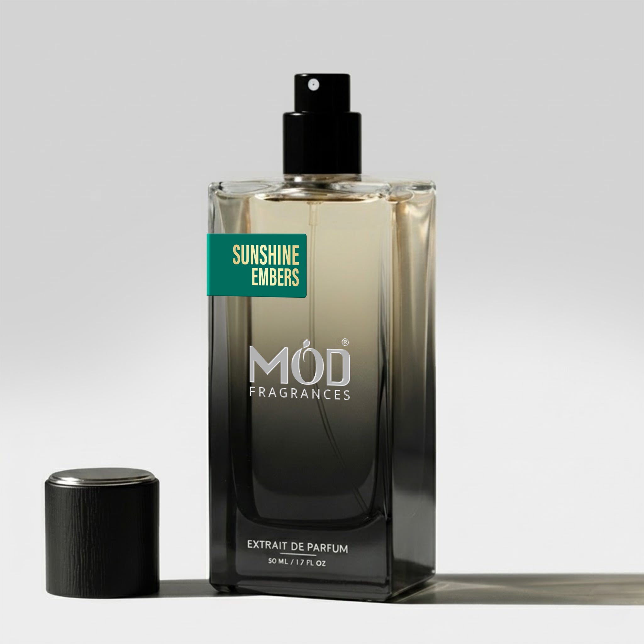 Inspired by Greenwich Village Perfume Dupe. Sunshine Embers by Mod Fragrances with cap on floor. Spray Bottle