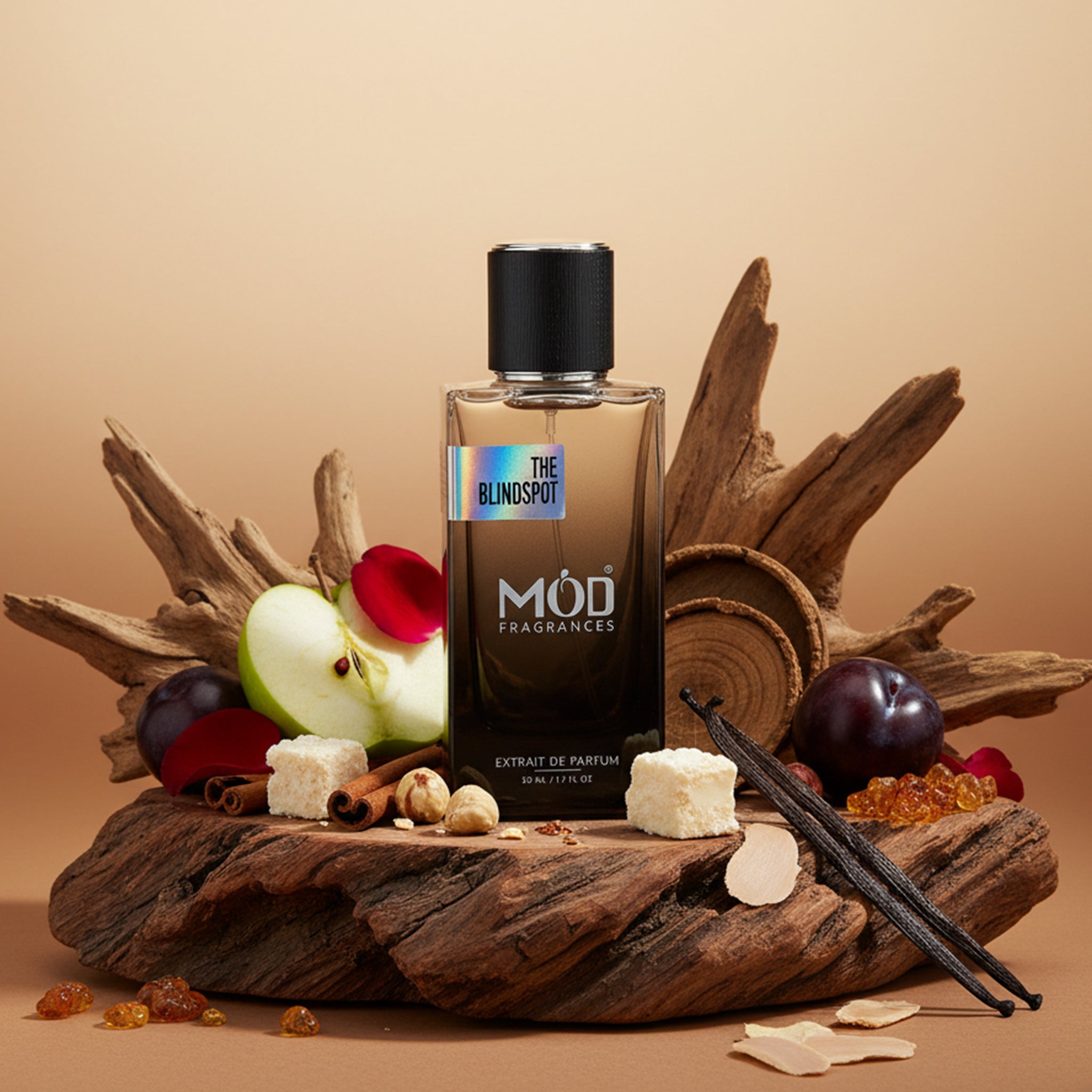 Möd Fragrances perfume bottle on a wooden platform with fruits and spices