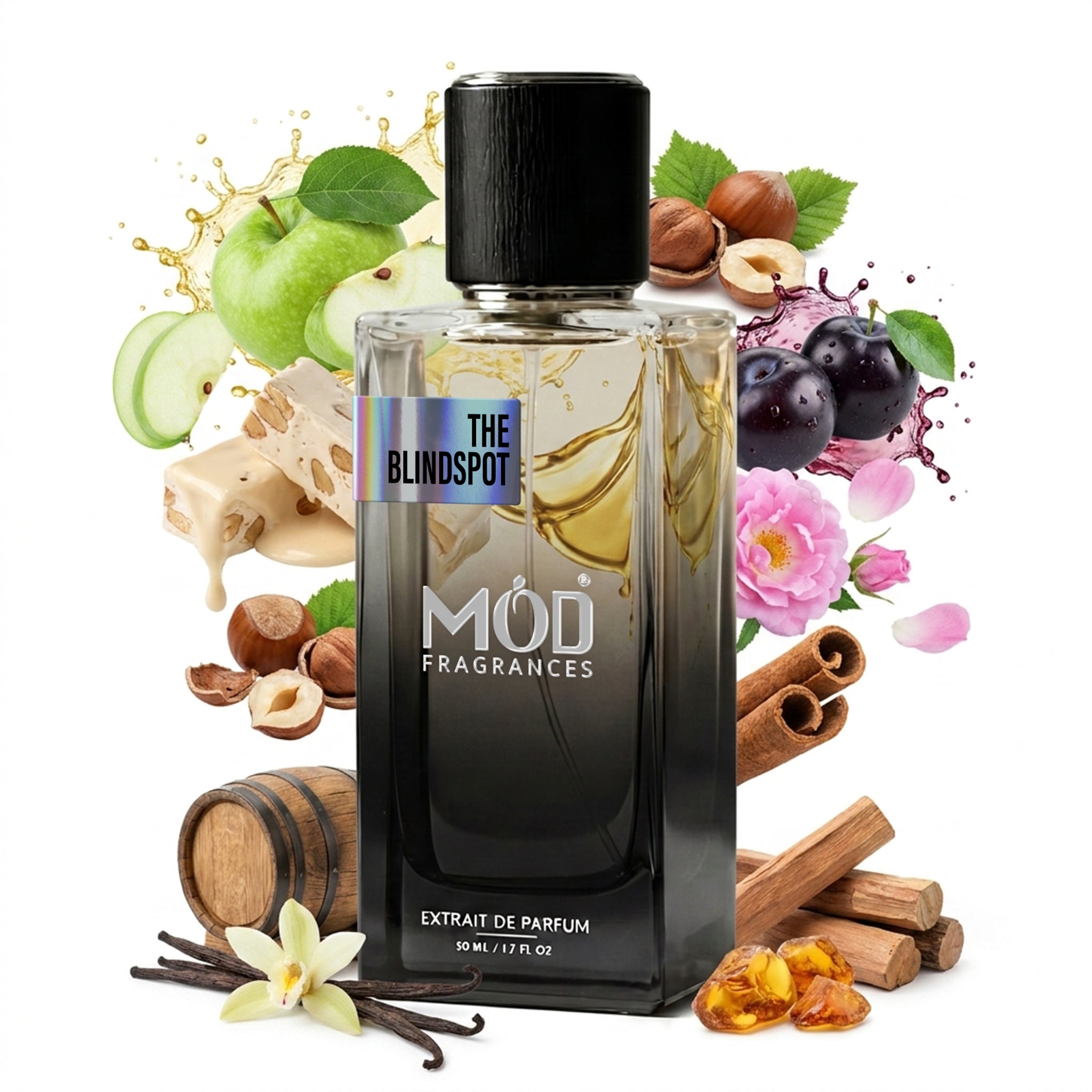 A glass perfume bottle by MOD Fragrances, labeled "The Blindspot" is surrounded by a vibrant artistic arrangement of its fragrance ingredients, including green apple, black plum, nouga, oak barrel, vanilla, bulgarian rose, cinnamon bark, hazelnuts and amber crystals against a white background.