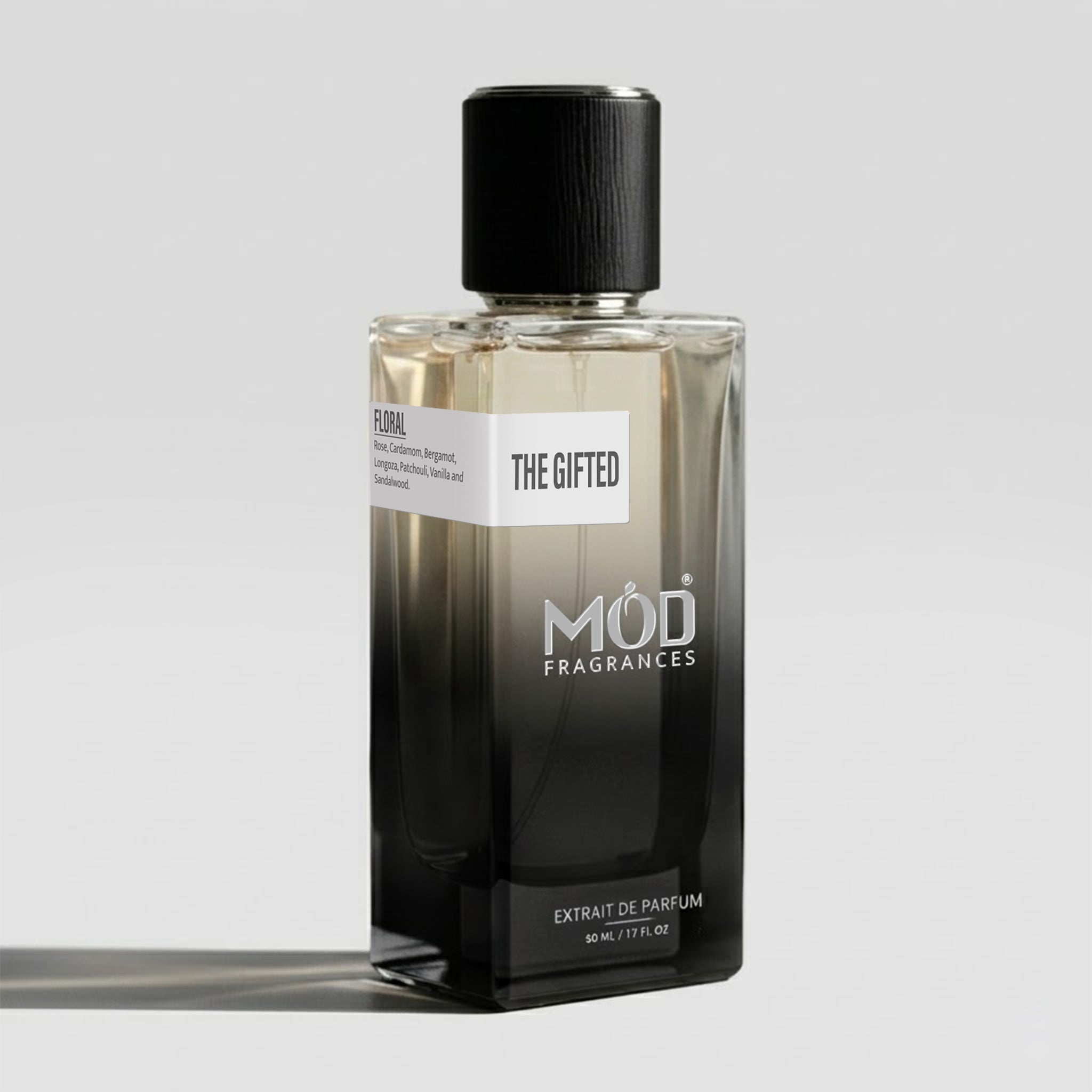 Perfume bottle labeled 'The Gifted' by MOD Fragrances on a light gray background