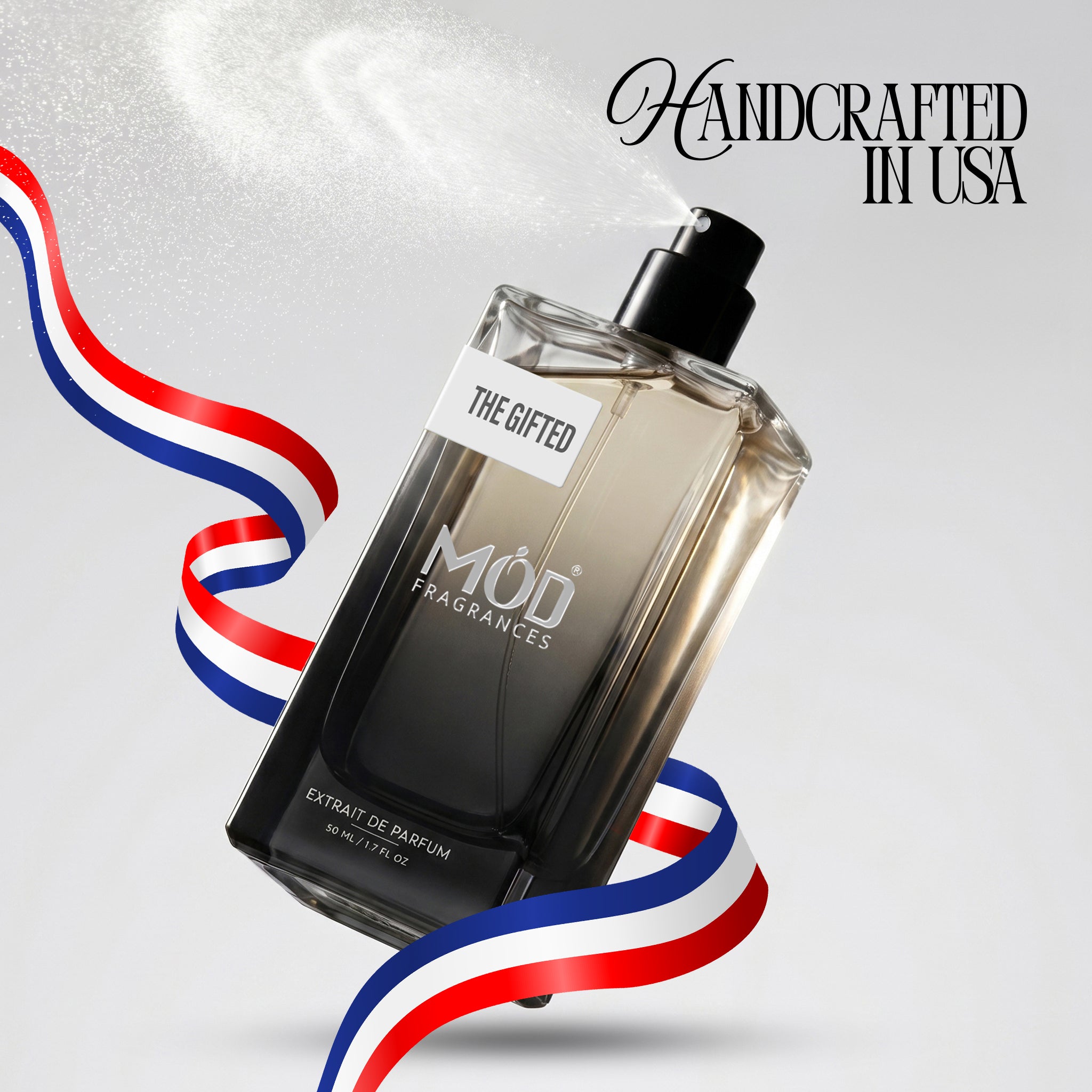 Perfume bottle labeled 'MÖd Fragrances' with a patriotic ribbon on a light gray background.