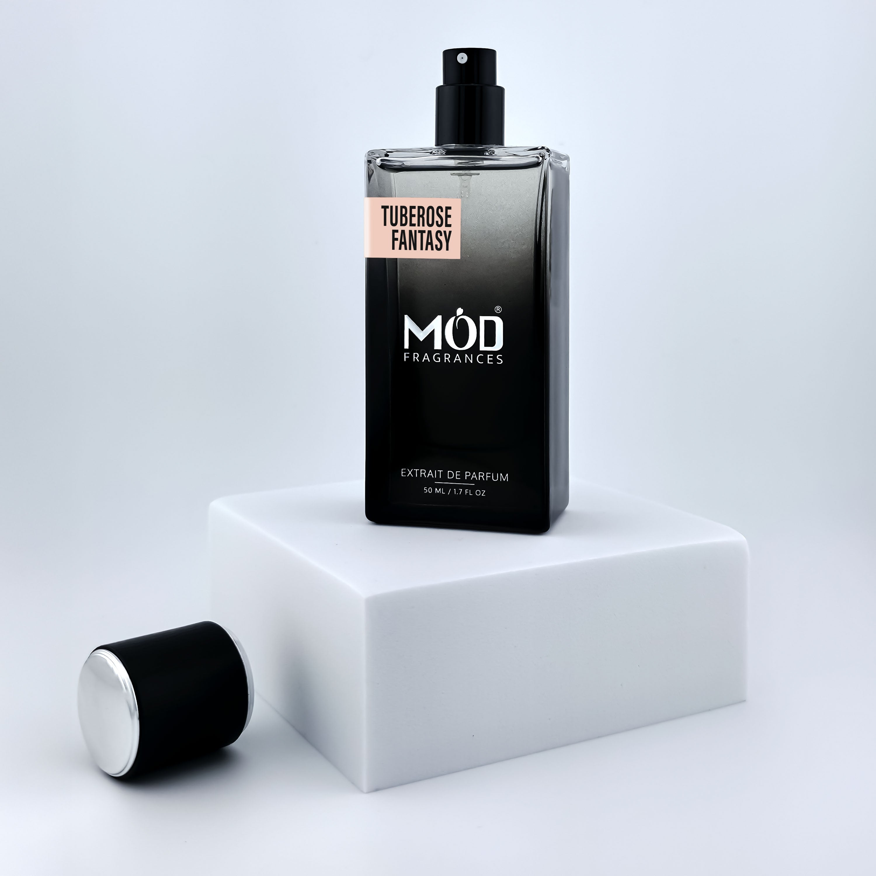 Black perfume bottle with 'MOD Fragrances' branding on a white platform.
