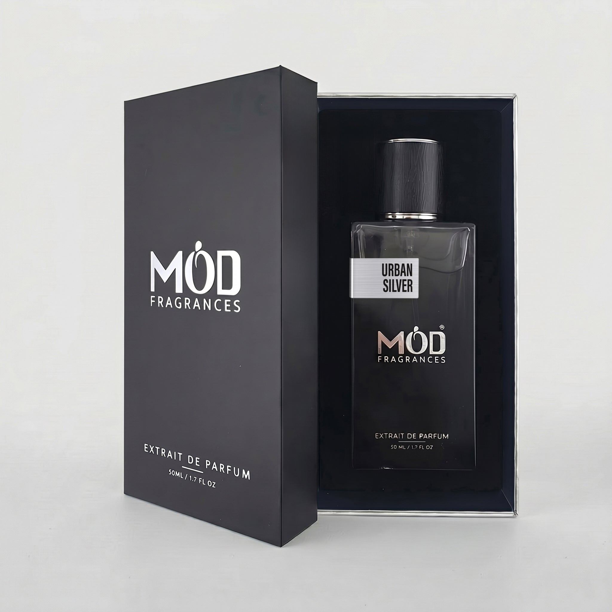 An open premium black perfume box reveals a rectangular glass bottle labeled “Urban Silver” by MOD Fragrances, resting securely in a black-lined presentation case.