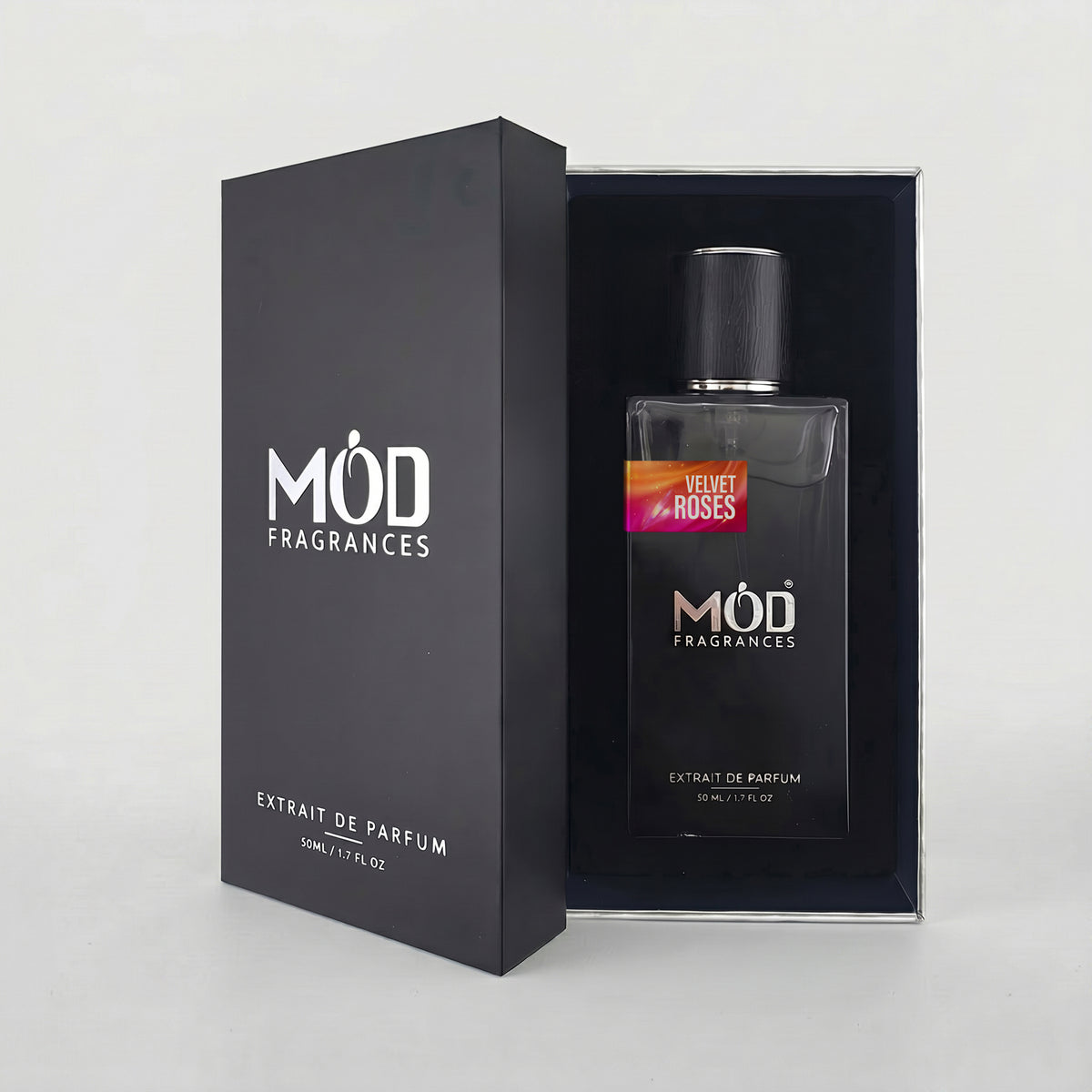 A bottle of MOD FRAGRANCES Extrait de Parfum in 'Mandarin Royale' scent, displayed next to its black outer packaging box on a light gray background.
