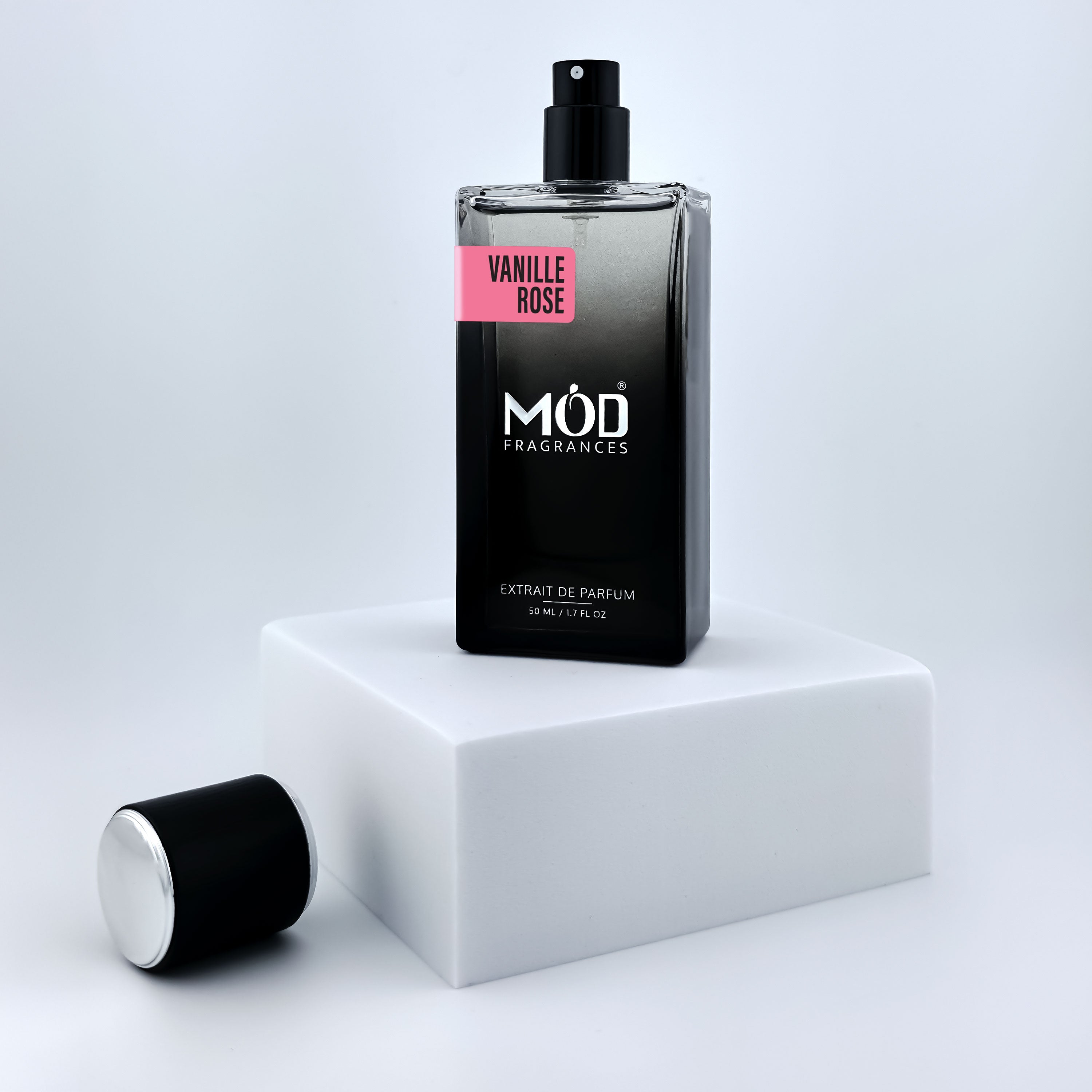Black Möd Fragrances Vanille Rose perfume bottle on a white platform with a light gray background