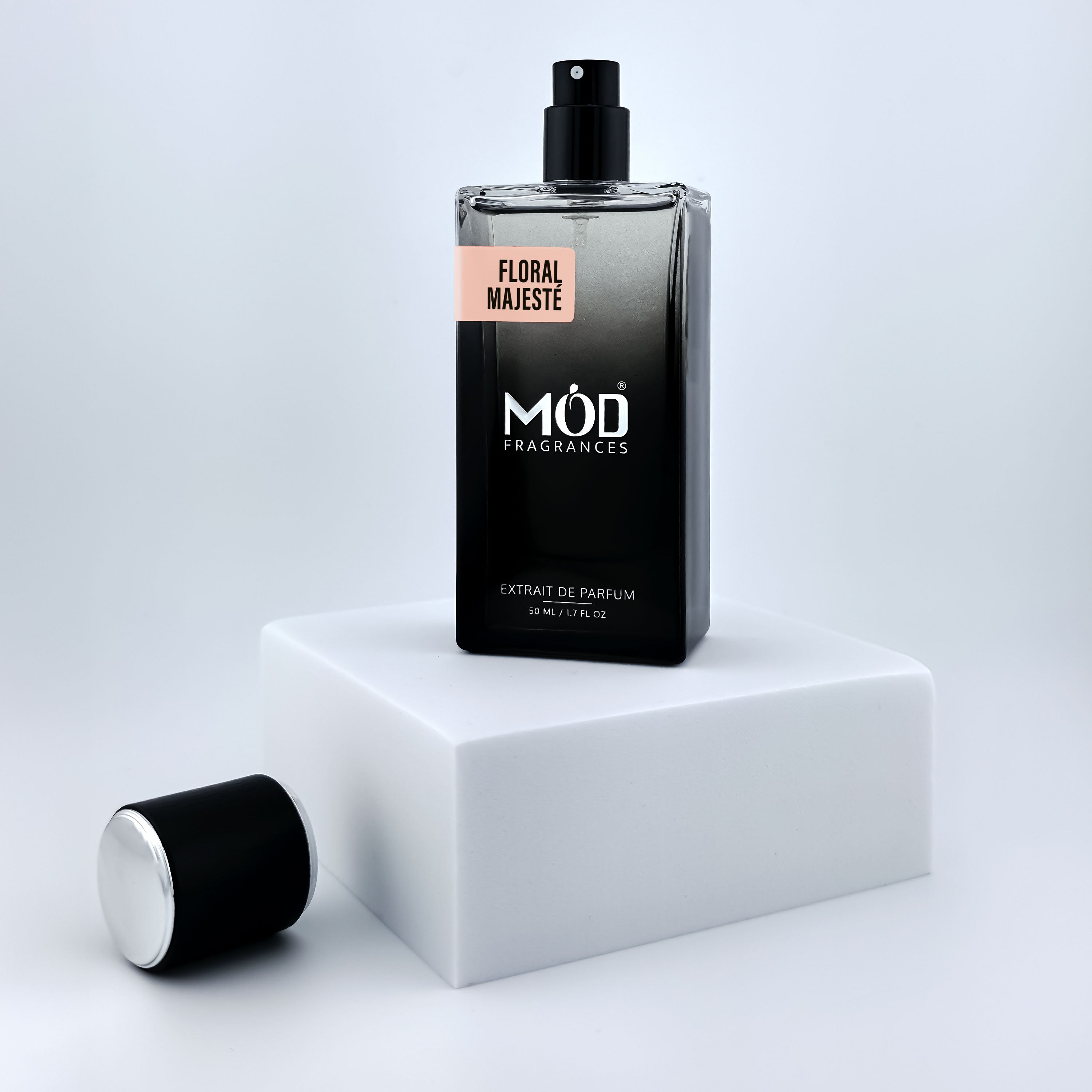 Inspired by Idole Perfume Dupe  Perfume bottle labeled 'Möd Fragrances' on a white platform with a light gray background