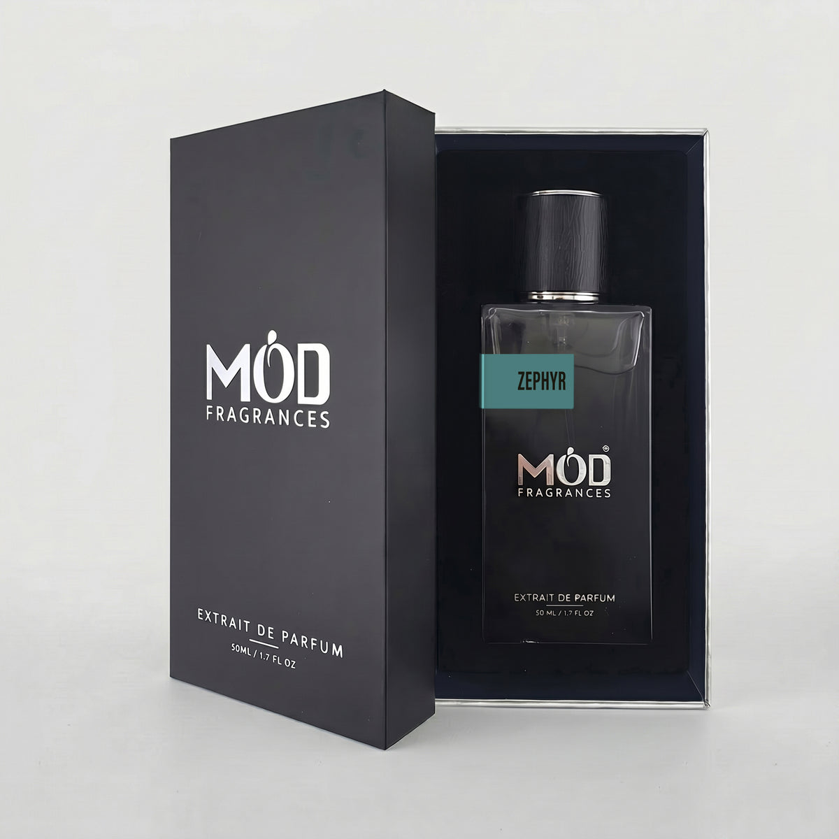 An open premium black perfume box reveals a rectangular glass bottle labeled “Zephyr” by MOD Fragrances, resting securely in a black-lined presentation case.